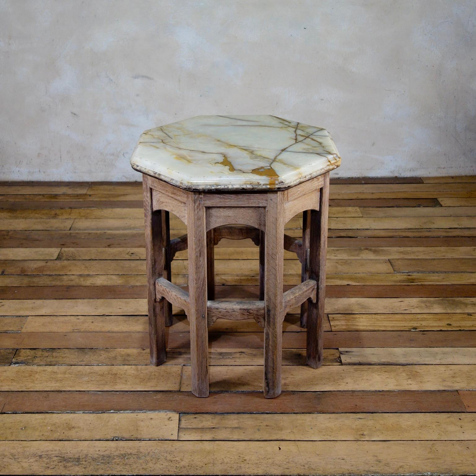 A charming 19th century oak octagonal table, raised on eight hexagonal shaped legs united by a framework of arched cross-stretchers. Displaying an exceptional onyx top displaying deep yellow veining. 
 
Measures:
Width 62cm
Height 71cm.