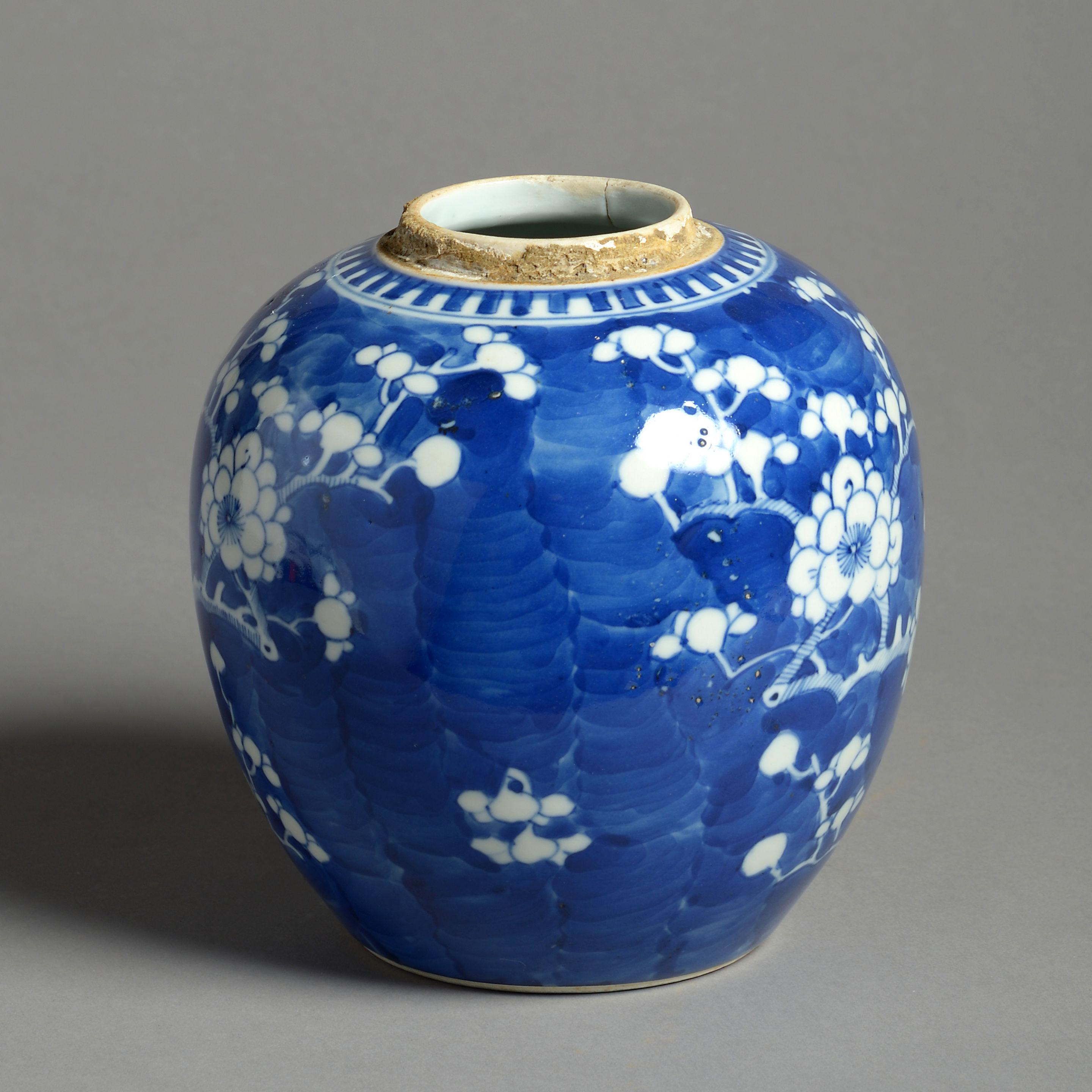 A 19th century blue and white porcelain jar, decorated throughout with stylised prunus blossoms. 

Late Qing Dynasty.