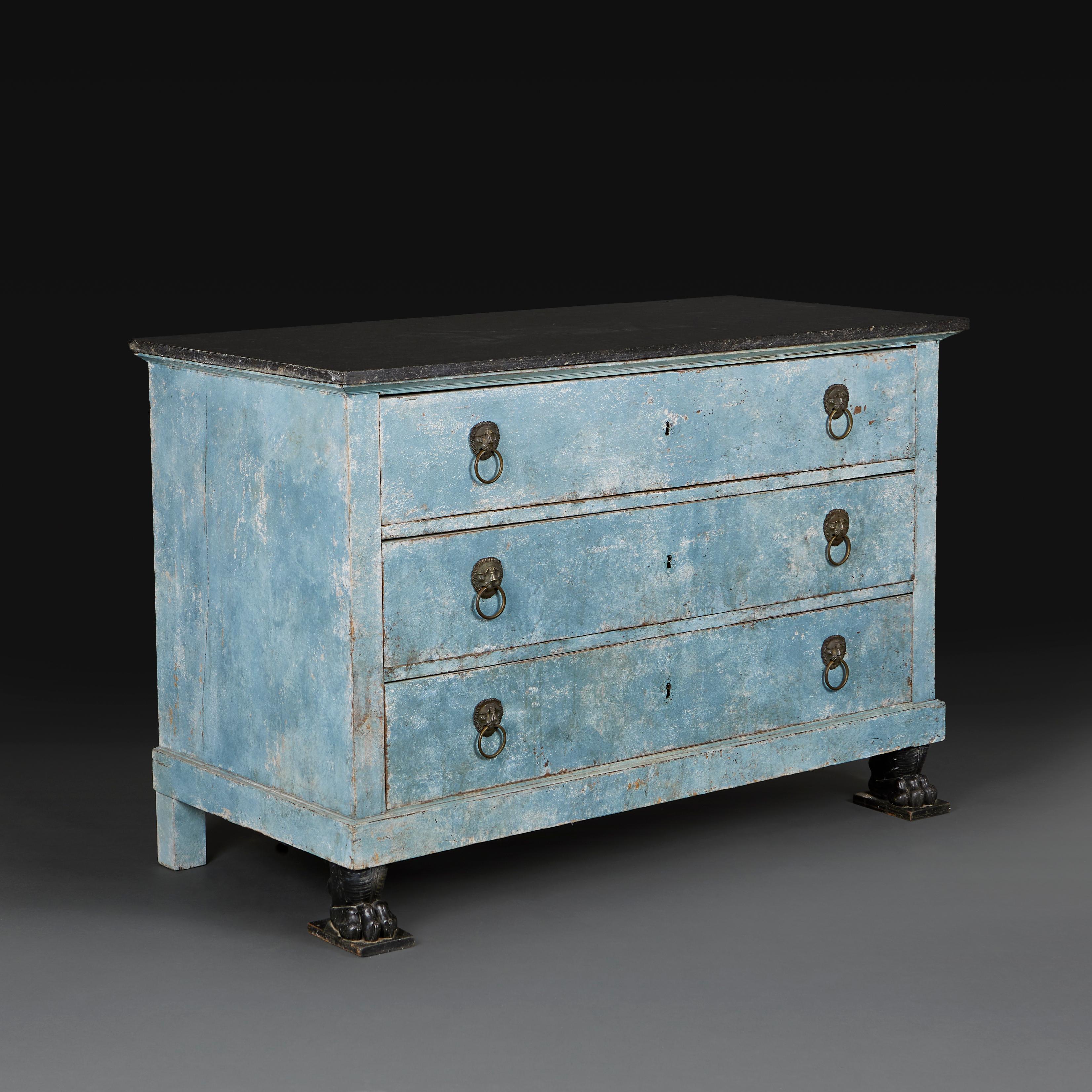 France, circa 1820
An early nineteenth century blue painted Empire commode with three drawers, bronze lion mask handles, all supported on simulated crocodile feet, with black marble top. The paint with restorations. 

Height  87.50cm
Width  