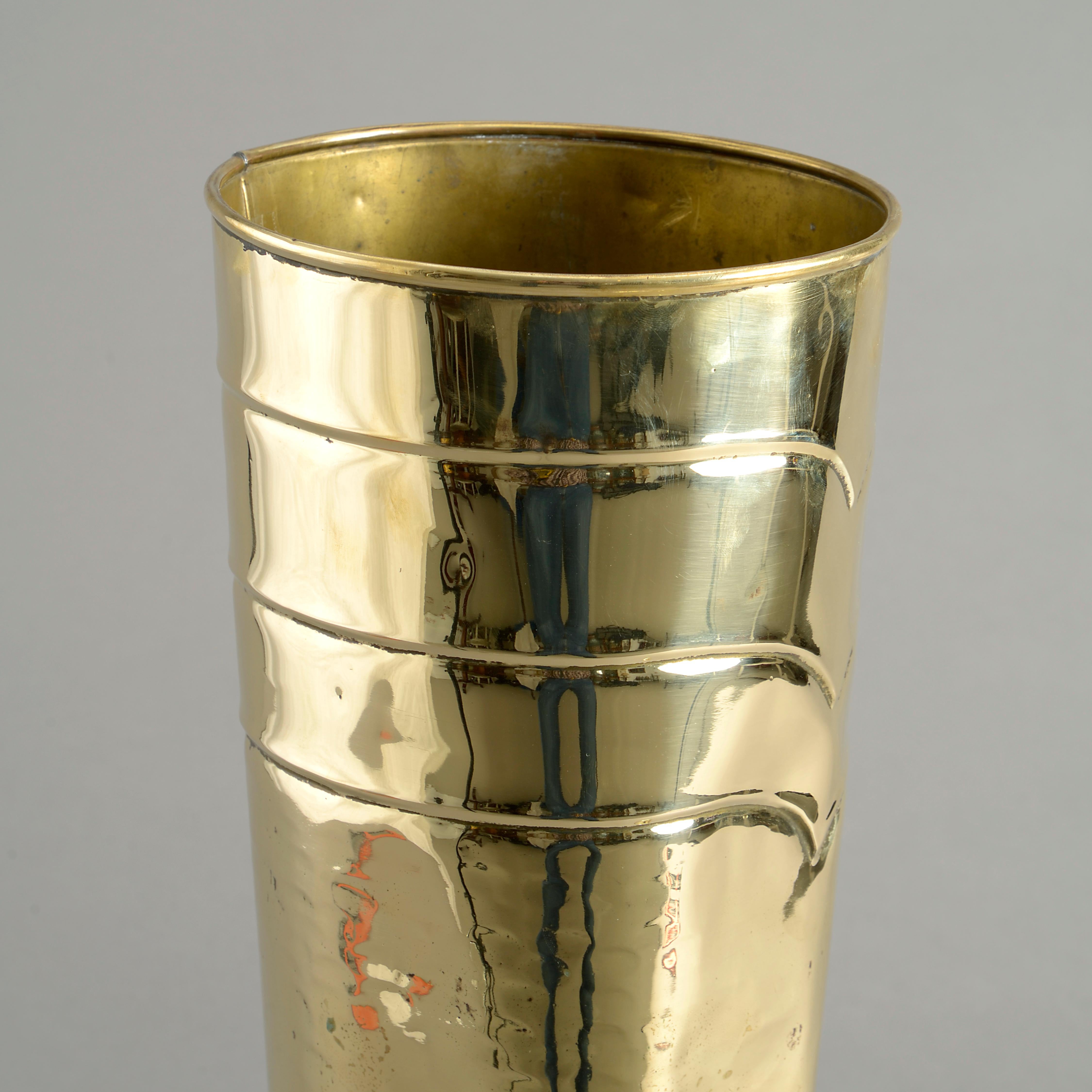 A late 19th century polished brass stick and umbrella stand, taking the form of a knight’s armoured boot.