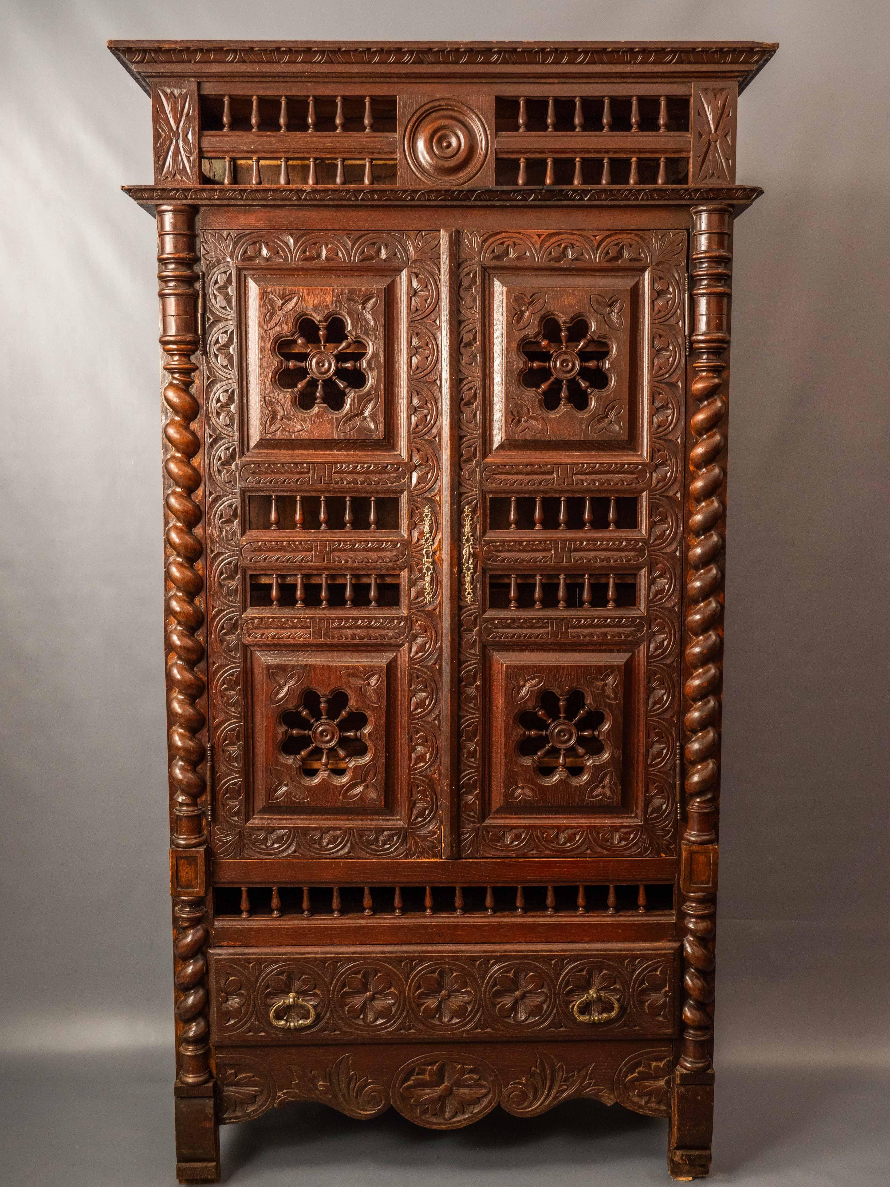 The cabinet was made in the second half of the 19th century. Provenance is Brittany - France. Very finely carved from solid oak. The sides of the cabinet are carved with mallet fillings. The front side is richly carved. Inside the cabinet there are