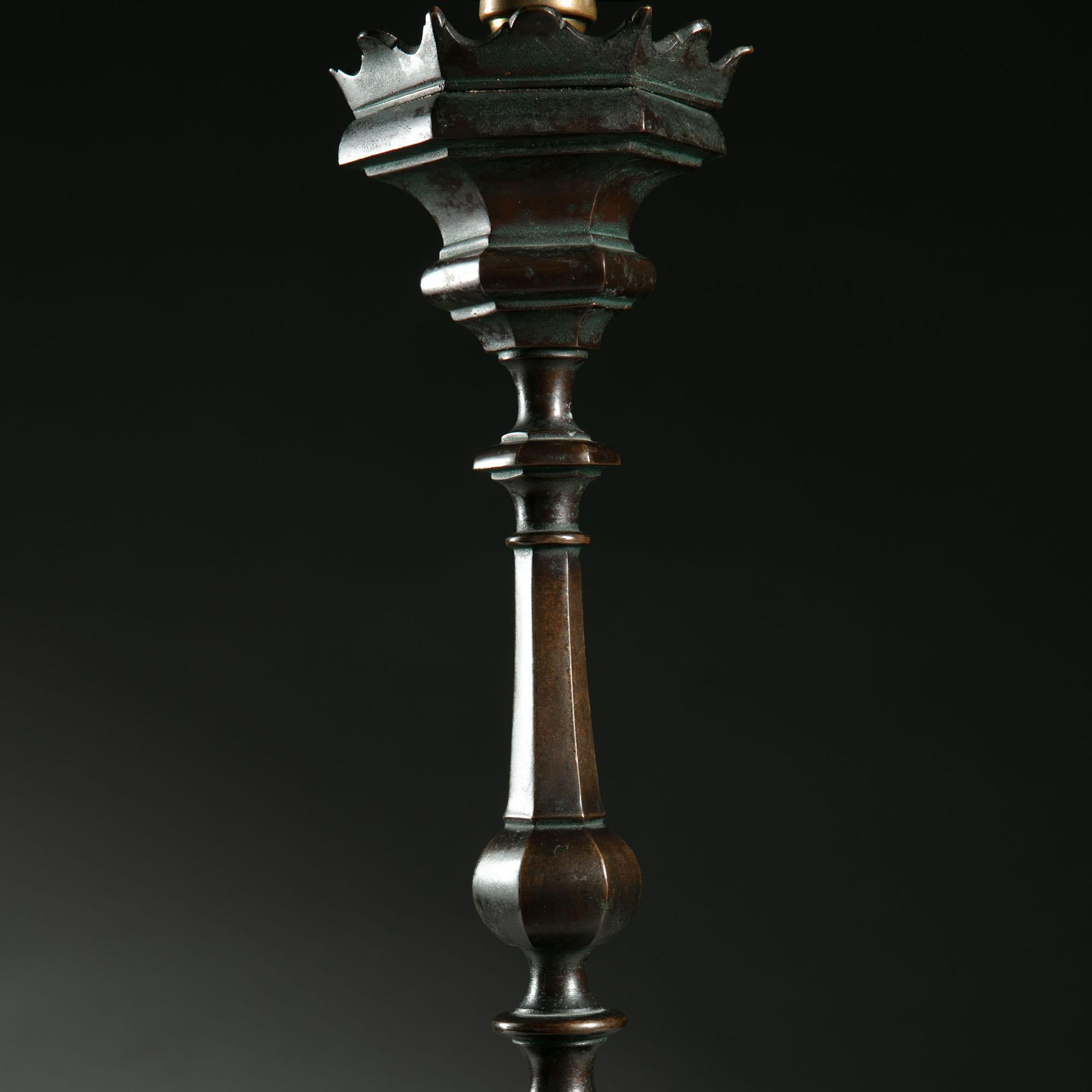 A mid-19th century bronze column lamp, with a tripod base.

Please note: Lampshade not included.

Currently wired for the UK.