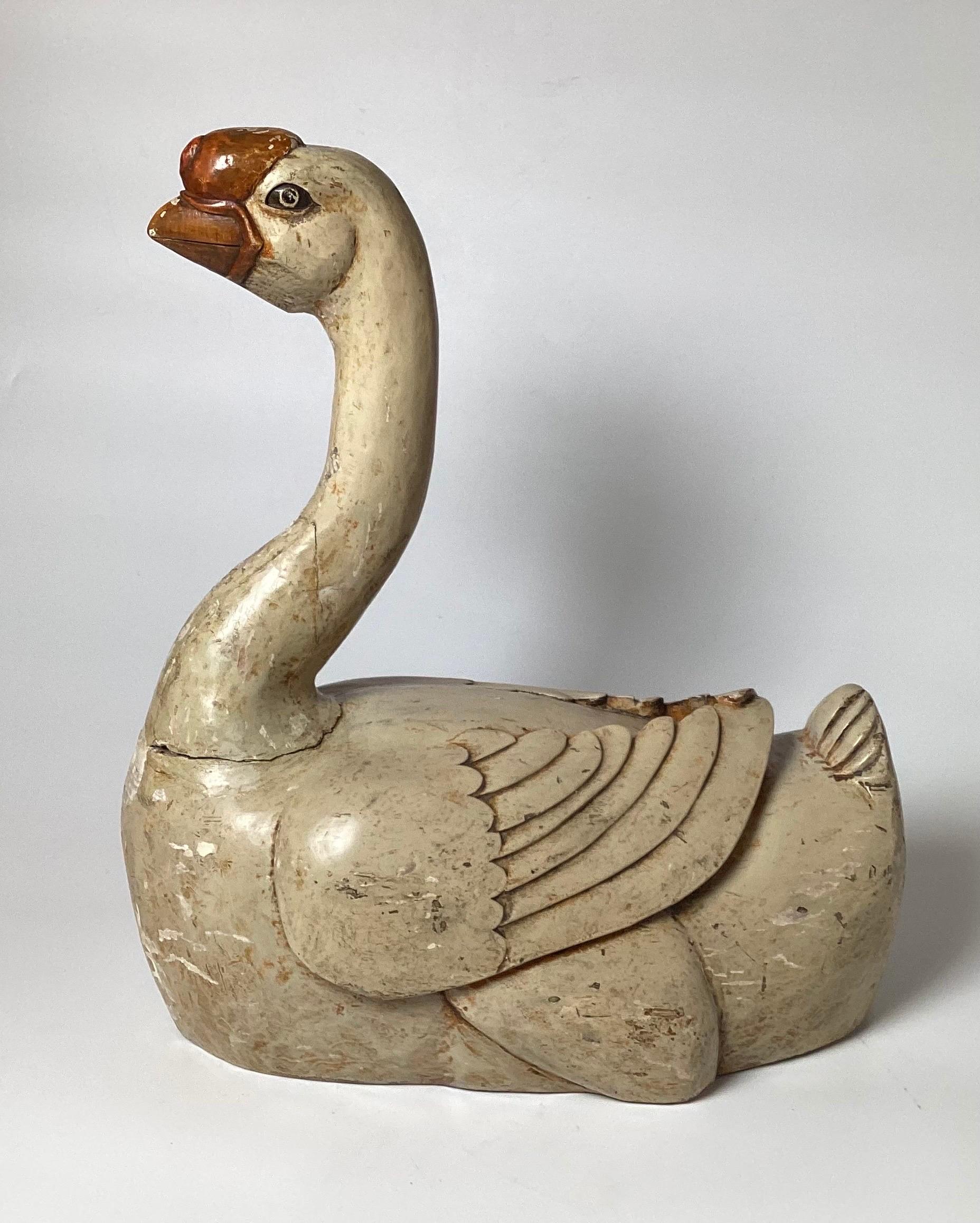 A rare Antique hand carved and painted 19th century Chinese figure of a Basal Knob goose. The figure retaining most of its original paint over gesso with flaking and cracking to the original finish.