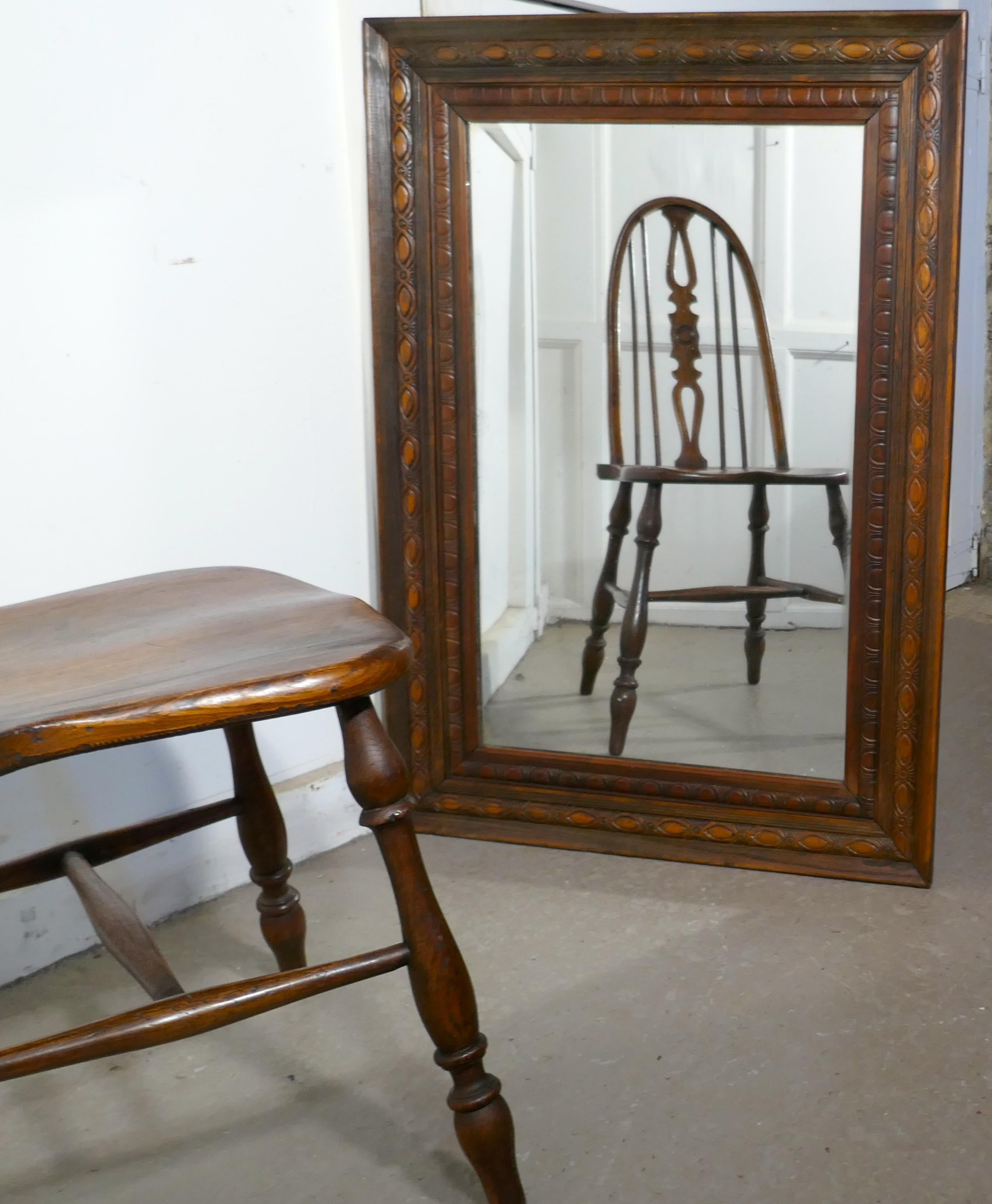A 19th century carved oak mirror

The oak mirror frame is 4.5” wide and carved in the style typical of this time
The heavy mercury plate glass mirror has a wonderful sparkle, all in good condition with a replaced back
The mirror is 38.5” high,
