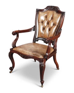 A 19th Century Carved Rosewood and Leather Armchair