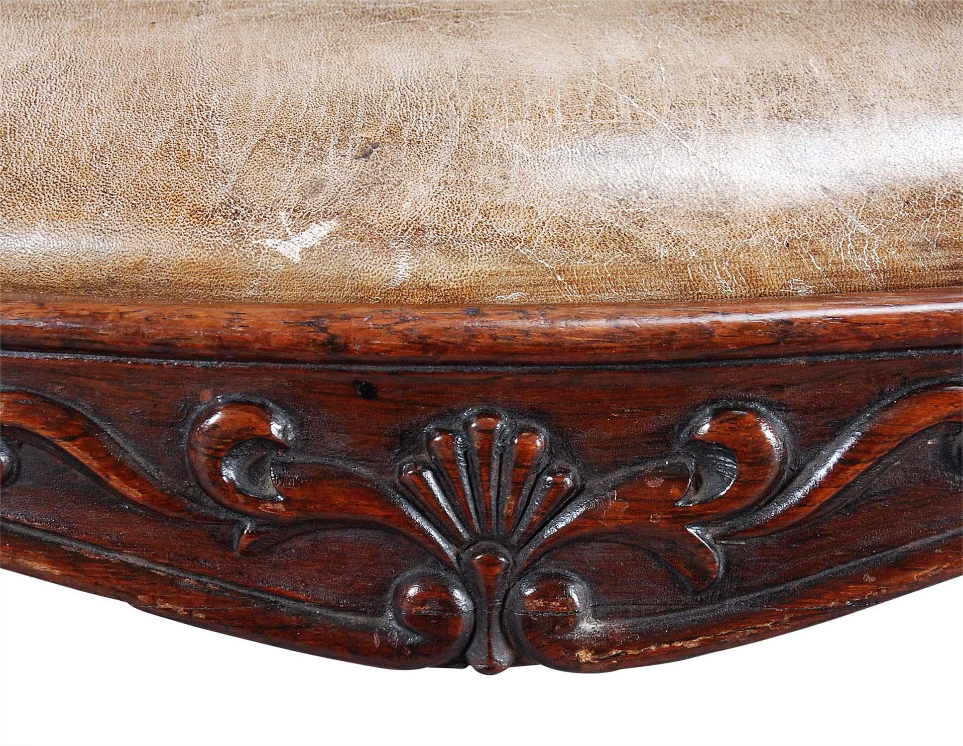 English A 19th Century Carved Rosewood and Leather Armchair For Sale