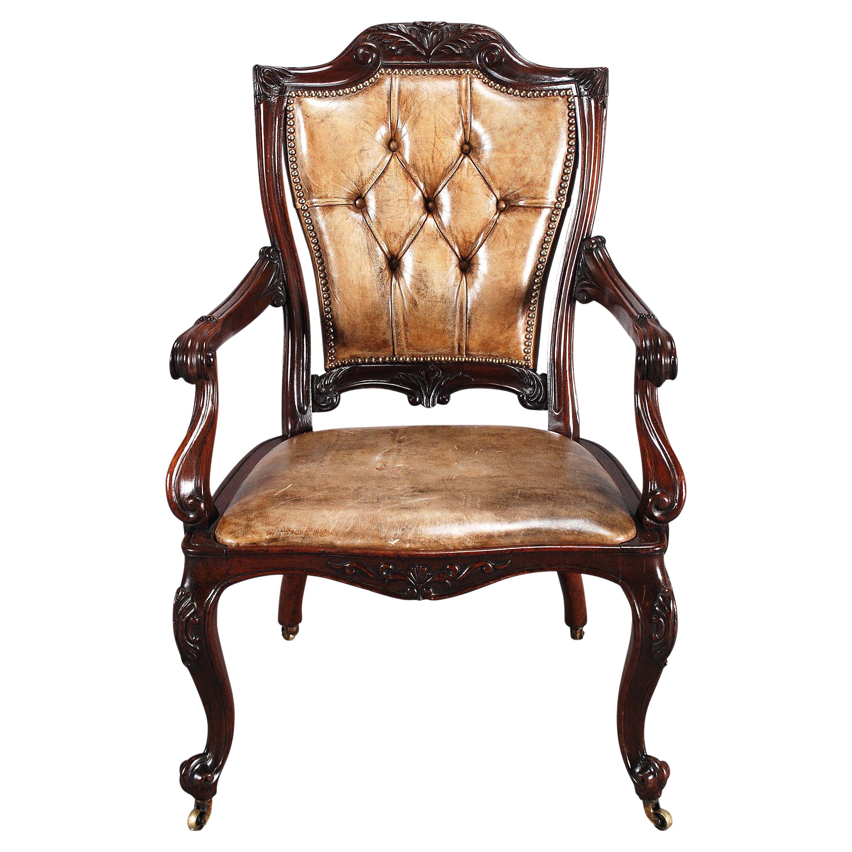 A 19th Century Carved Rosewood and Leather Armchair For Sale