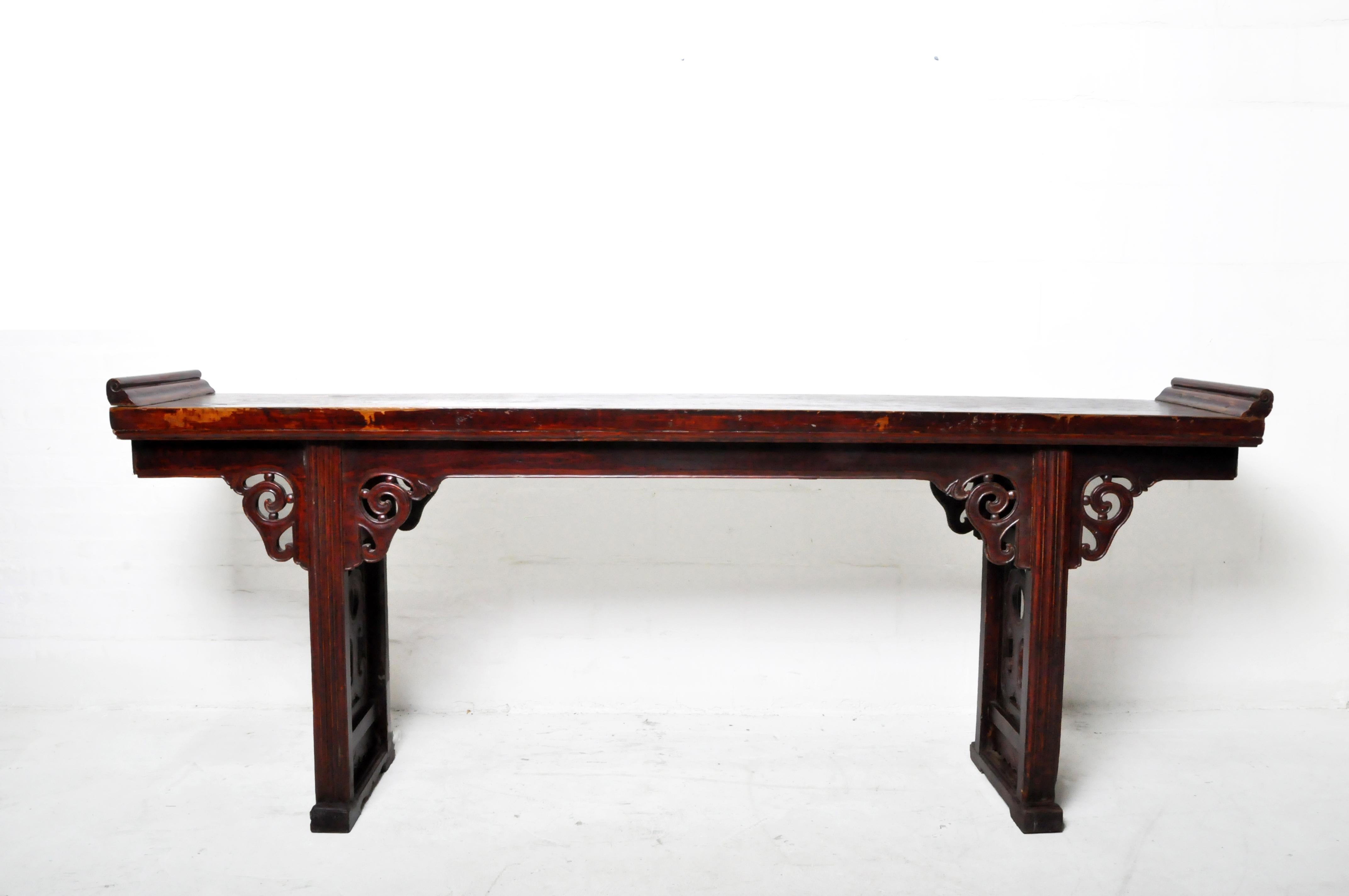 This long, elegant altar table once provided a place to burn incense or display valuable art objects. It may have been used in the reception hall of a private mansion or in an ancestral shrine. Its distinctive feature is its extreme simplicity -it