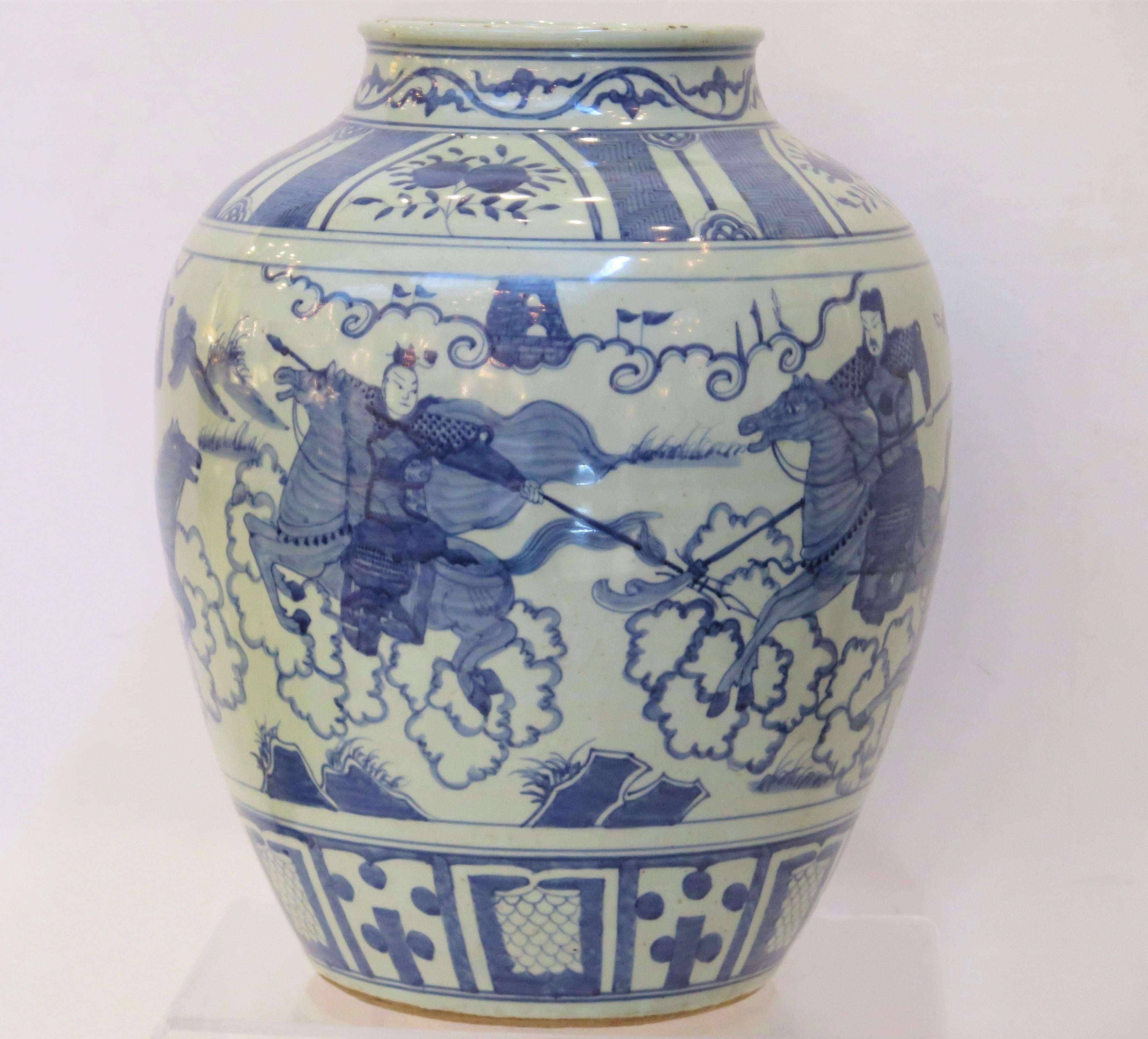 A 19th Century chinese blue and white jarn decorated with men on horseback / warriors.    ( Chinese Porcelain Jar ) 

16.5