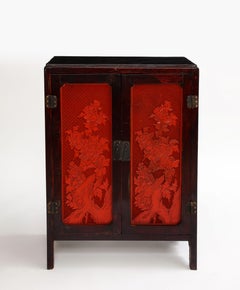 A 19th Century Chinese Cinnabar Panel Inlaid Hardwood Cabinet