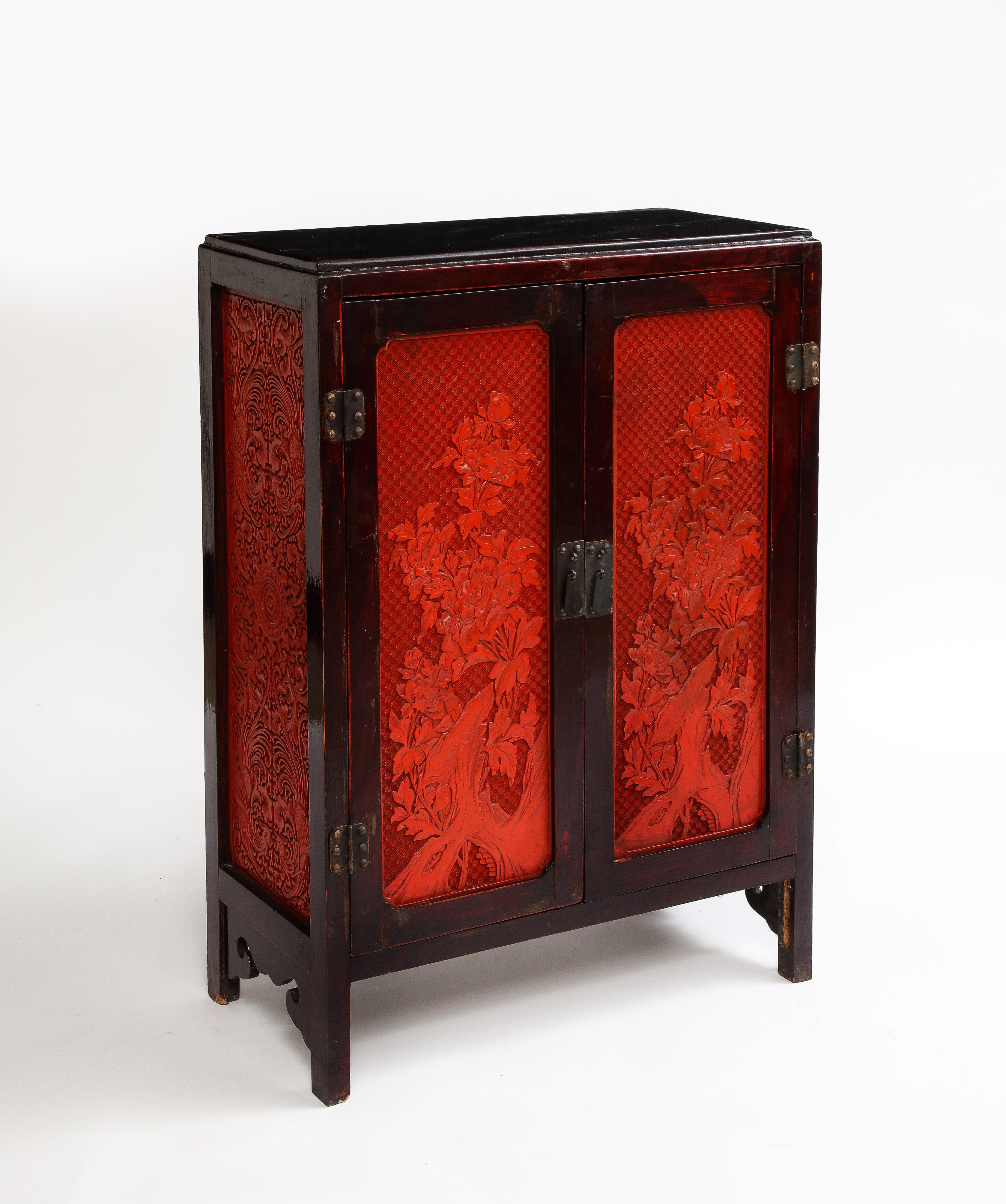 Chinese Export A 19th Century Chinese Cinnabar Panel Inlaid Hardwood Cabinet For Sale