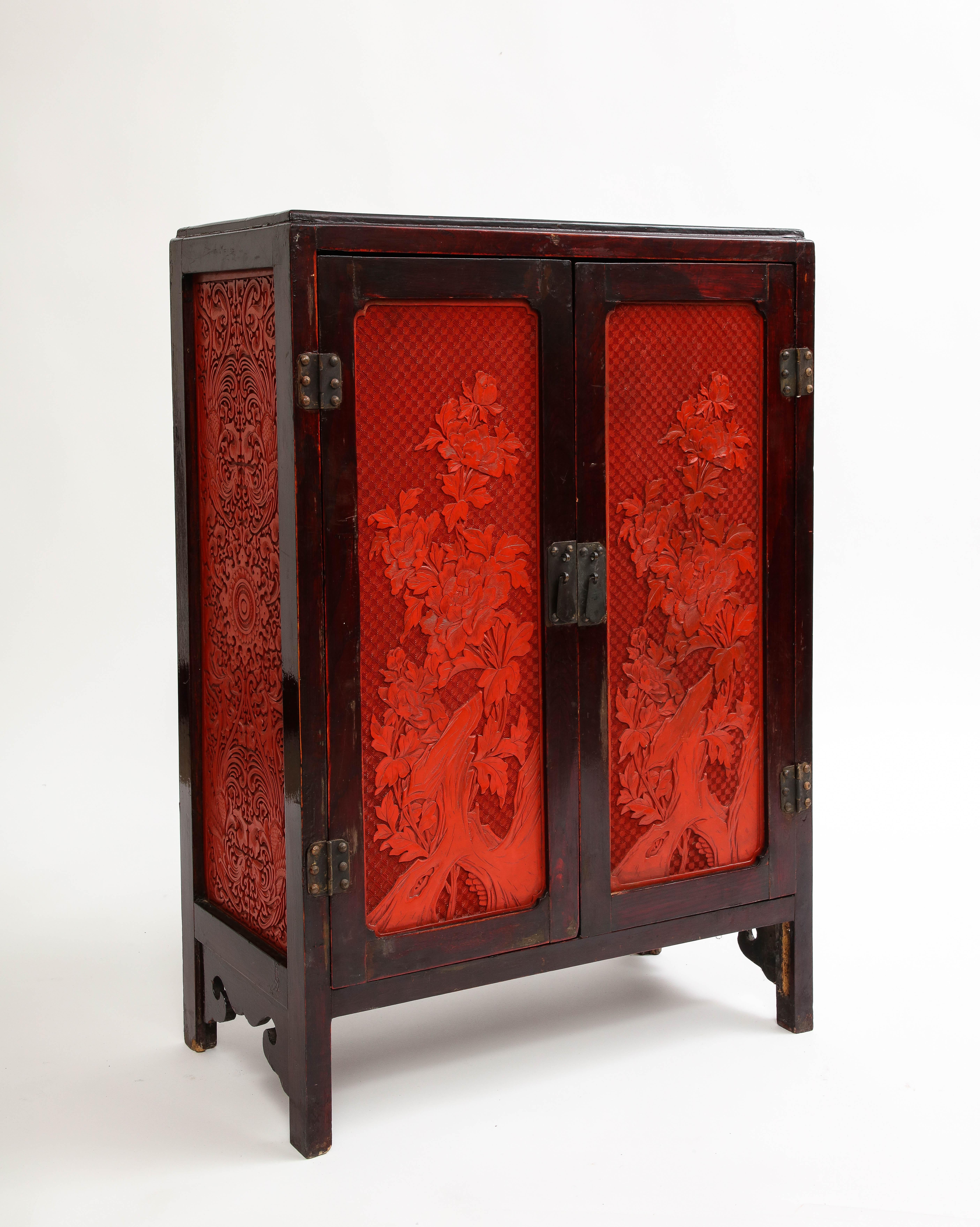 Hand-Carved A 19th Century Chinese Cinnabar Panel Inlaid Hardwood Cabinet For Sale