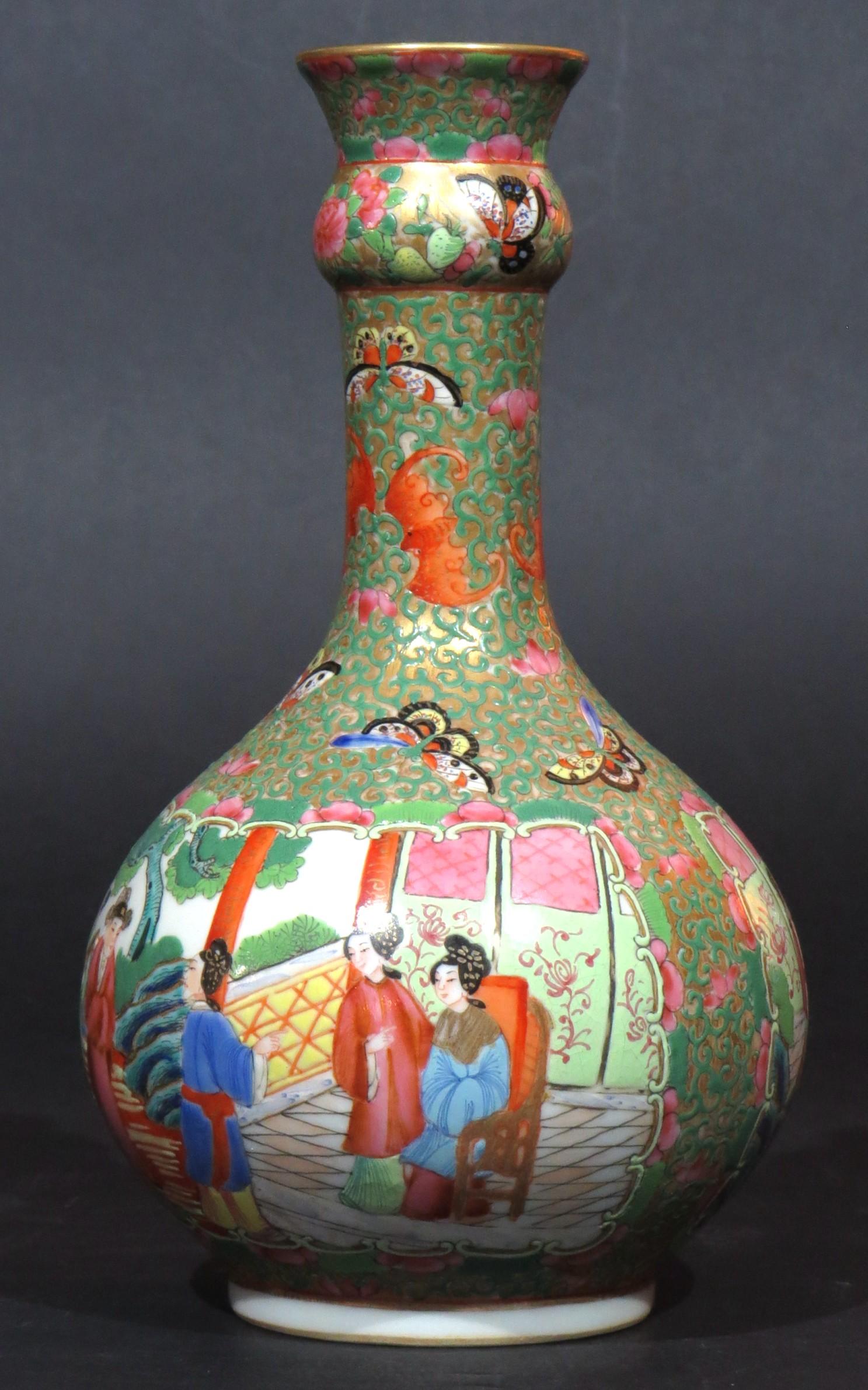 The globular base with rounded shoulders showing hand painted panels of courtly figures in garden settings, executed in a striking palette of vermillion, pink, green & blue enamels, against a jade green & gilt ground of intersecting scrolled motifs.