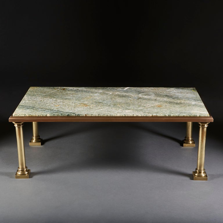 A fine late 19th century brass bound rectangular coffee table with green serpentine marble top, all supported on four turned gun barrel legs.
