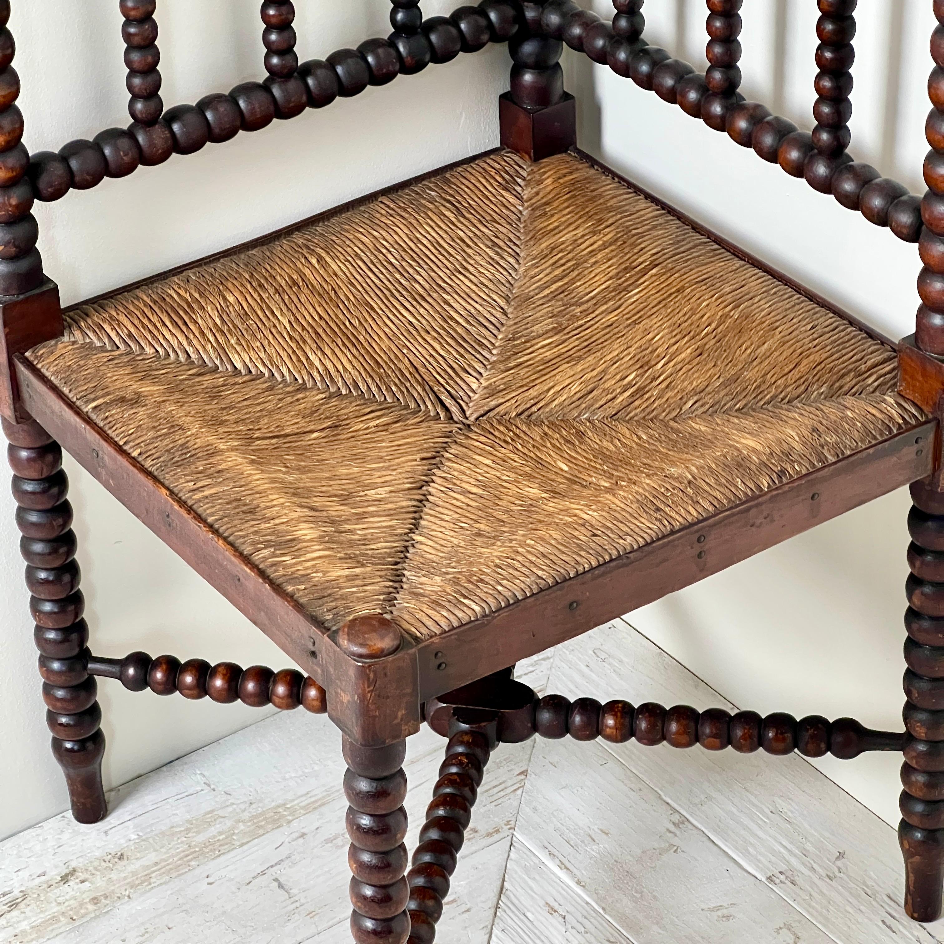 Late Victorian A 19th Century Corner Bobbin Chair With Rush Seat
