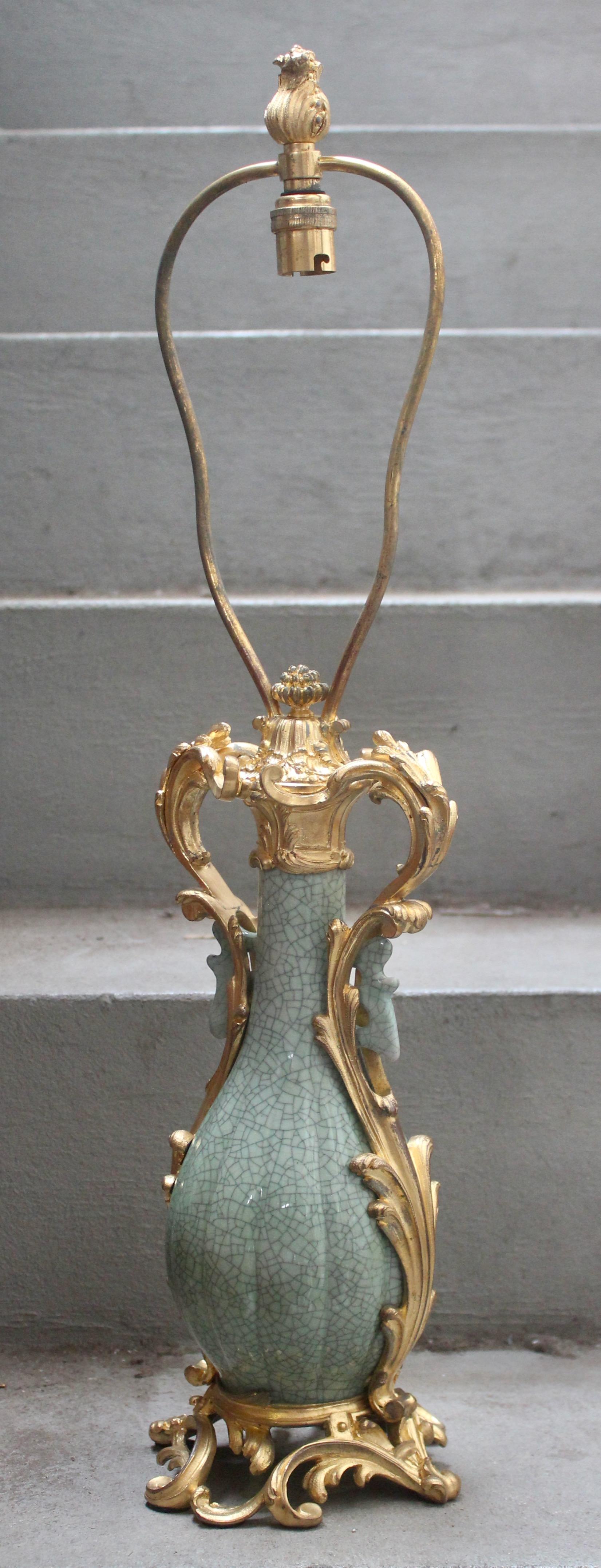 A 19th century Craquelé celadon porcelain vase ormolu-mounted in lamp
Green celadon Craquelé enameled porcelain vase
Ormolu-mounted in lamp
Original gilding
Louis XV style
circa 1870.

Measures: Vase height 36 cm 14.18 in.


  