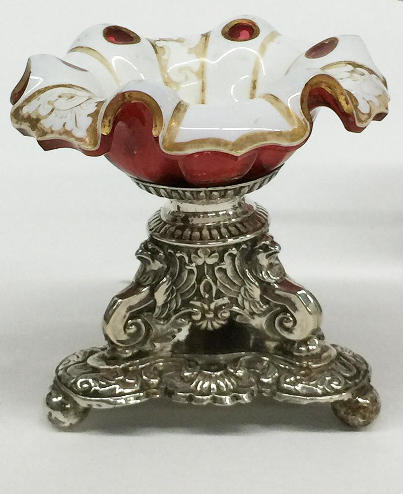 A 19th century Dutch silver Bohemian mustard pot and salt cellars

Silver smith Hubertus Gerardus Esser, Weert, 1838-1982

Marked with the old silver mark the sword and the master mark on the bottom of the foot. The mustard pot has been marked