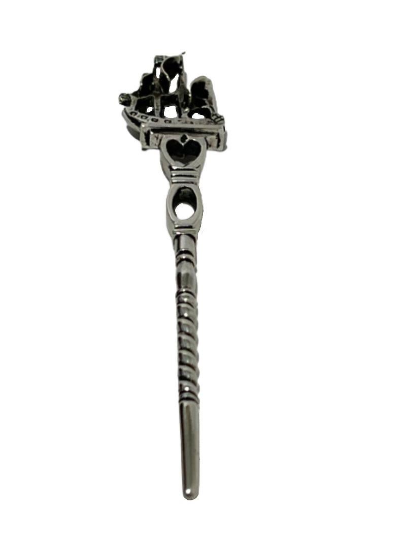 A 19th century Dutch silver pipe stopper with ship. 

A ship on a plateau on the stem. The stem is openwork and twisted. The pipe cleaner was originally a simple instrument only intended to empty the pipe bowl. 19th Century and Dutch hallmarked