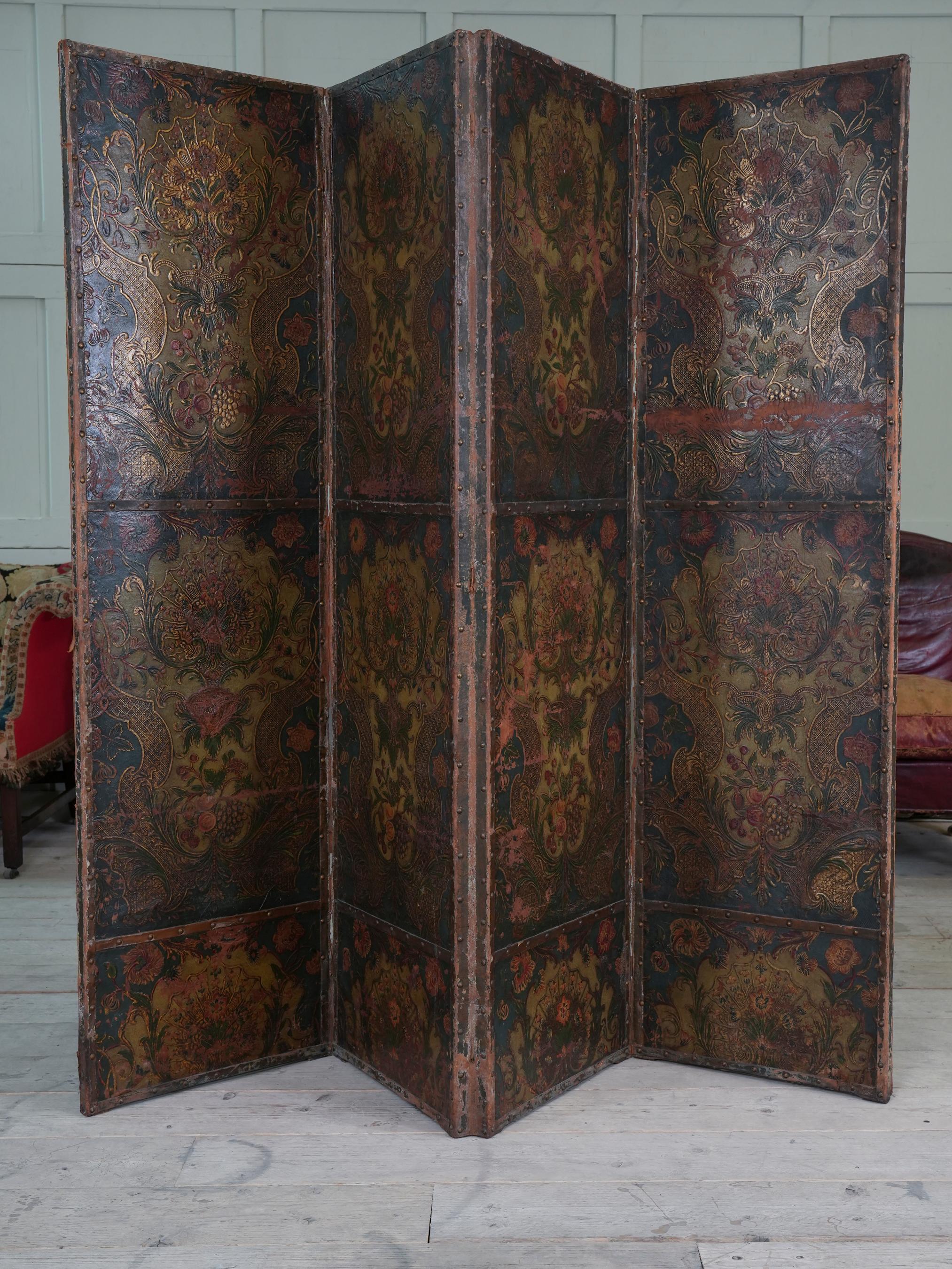 The four fold screen decorated to a single side with a repeating floral design on a dark blue ground.

Superb wall hanging decoration.
