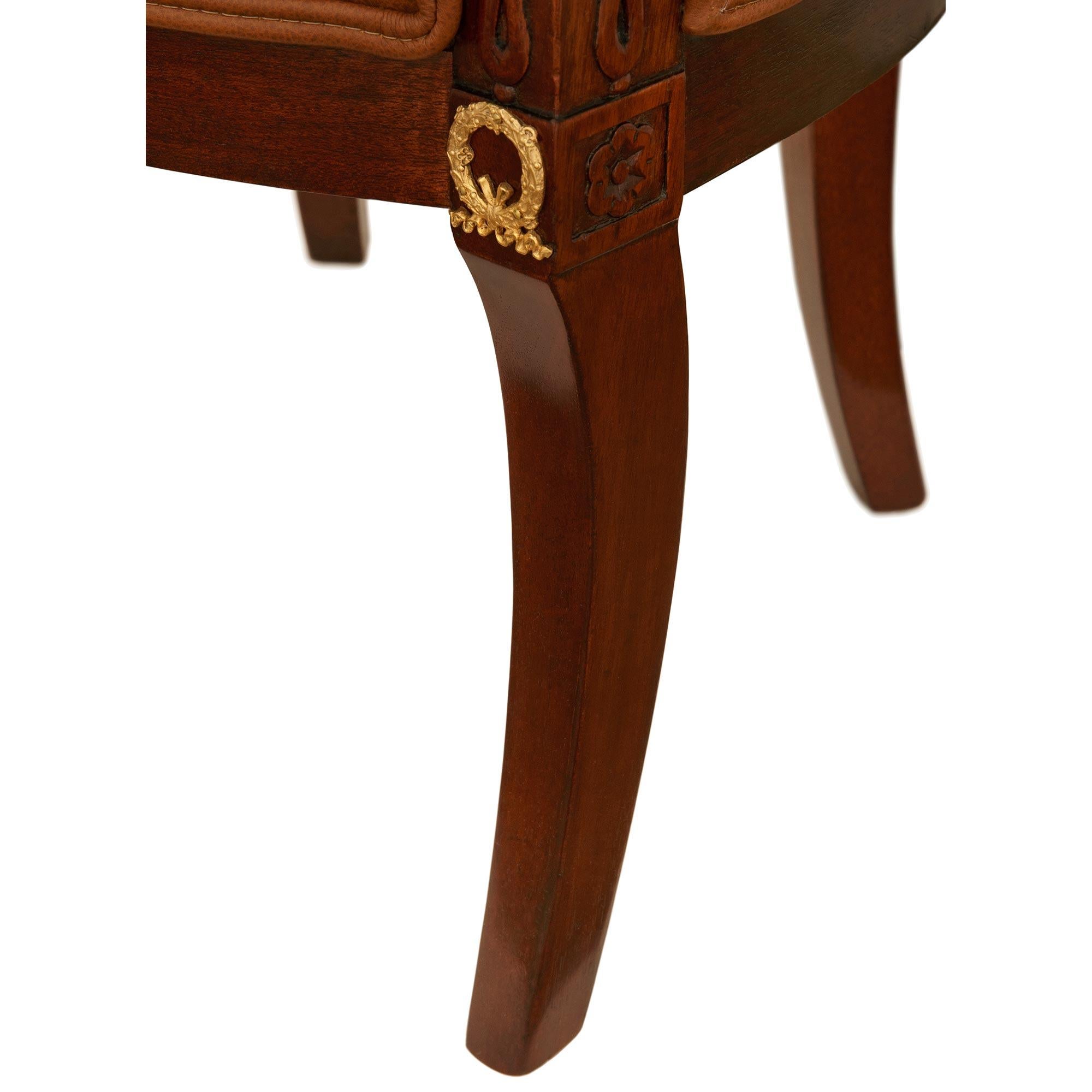 A 19th century Empire st. Mahogany, Giltwood, Ormolu and Leather armchair For Sale 5