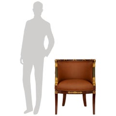 Poltrona stile Impero del XIX secolo in mogano, legno dorato, ormeggio e pelle