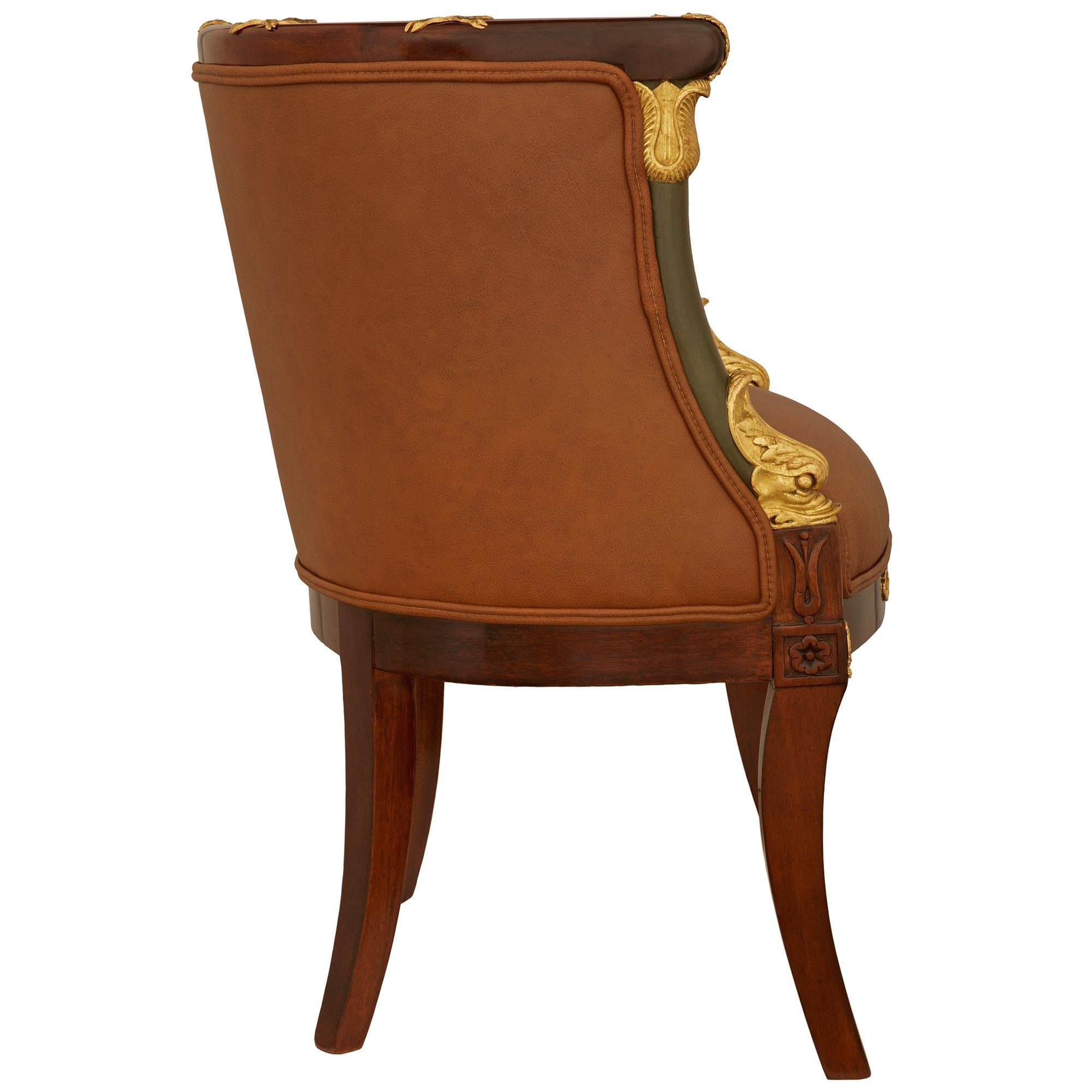 A 19th century Empire st. Mahogany, Giltwood, Ormolu and Leather armchair In Good Condition For Sale In West Palm Beach, FL
