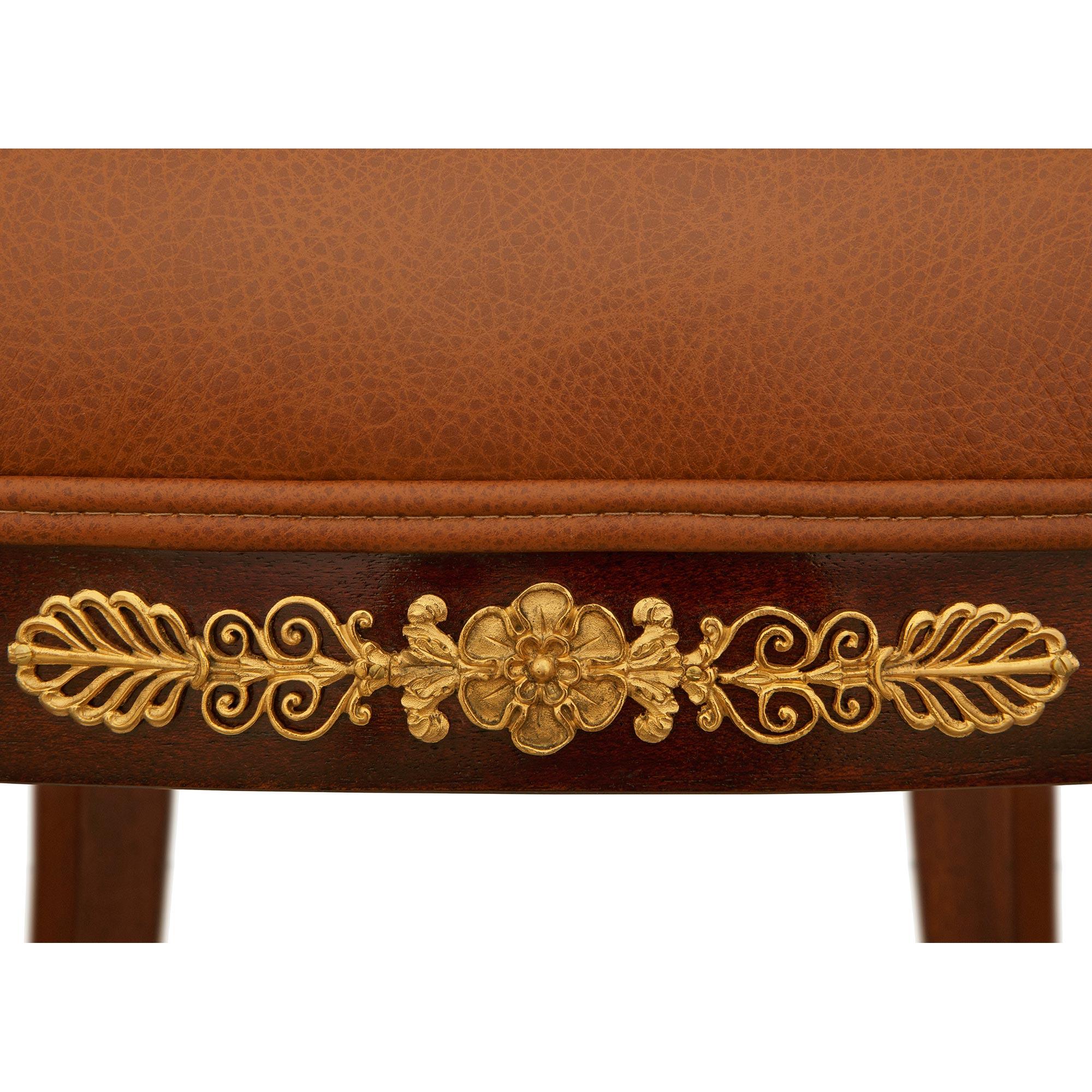 A 19th century Empire st. Mahogany, Giltwood, Ormolu and Leather armchair For Sale 4