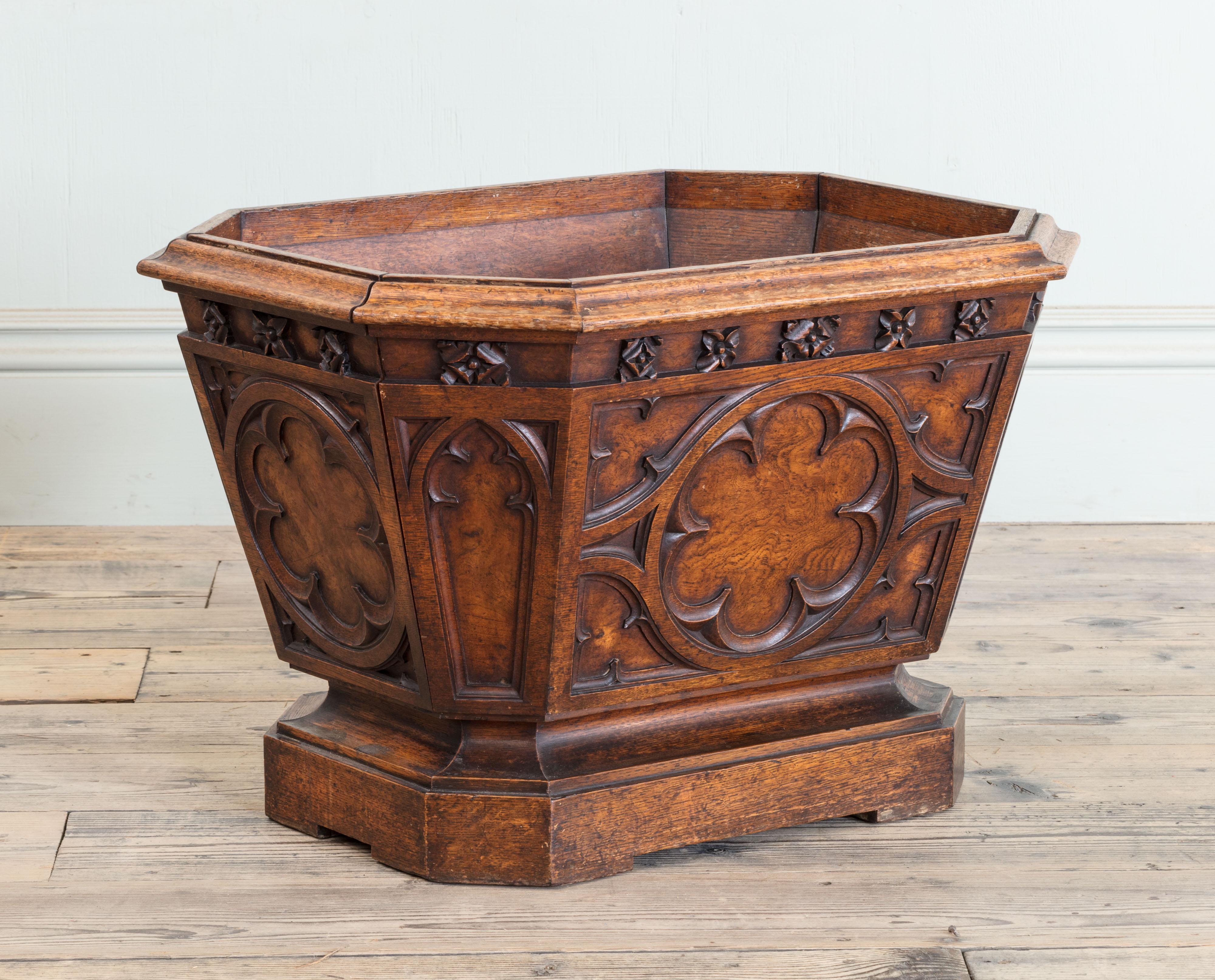 A 19th century English oak Gothic wine cooler.