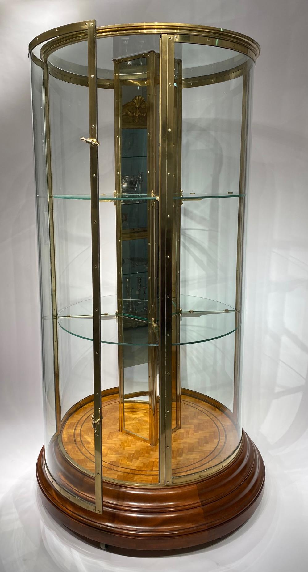 An early 20th century English round freestanding  display cabinet. 4