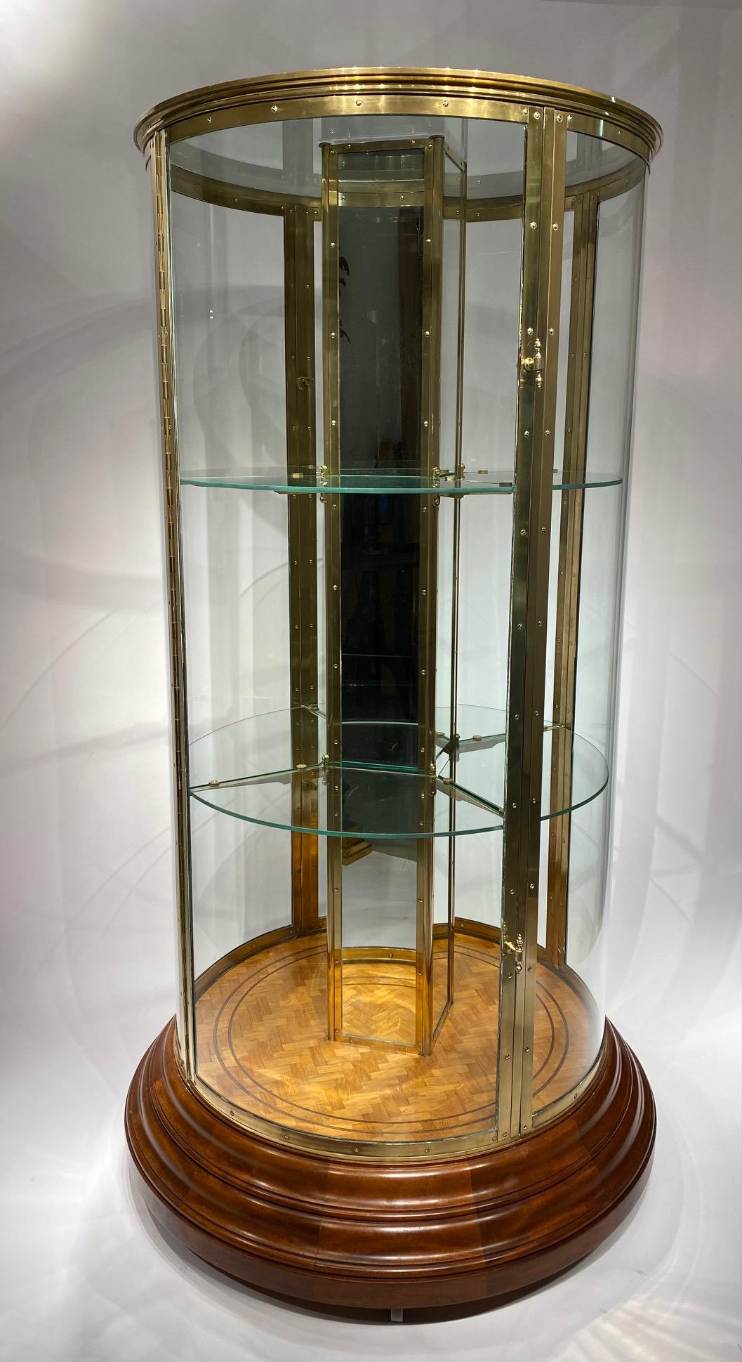 An early 20th century English round freestanding  display cabinet. 5