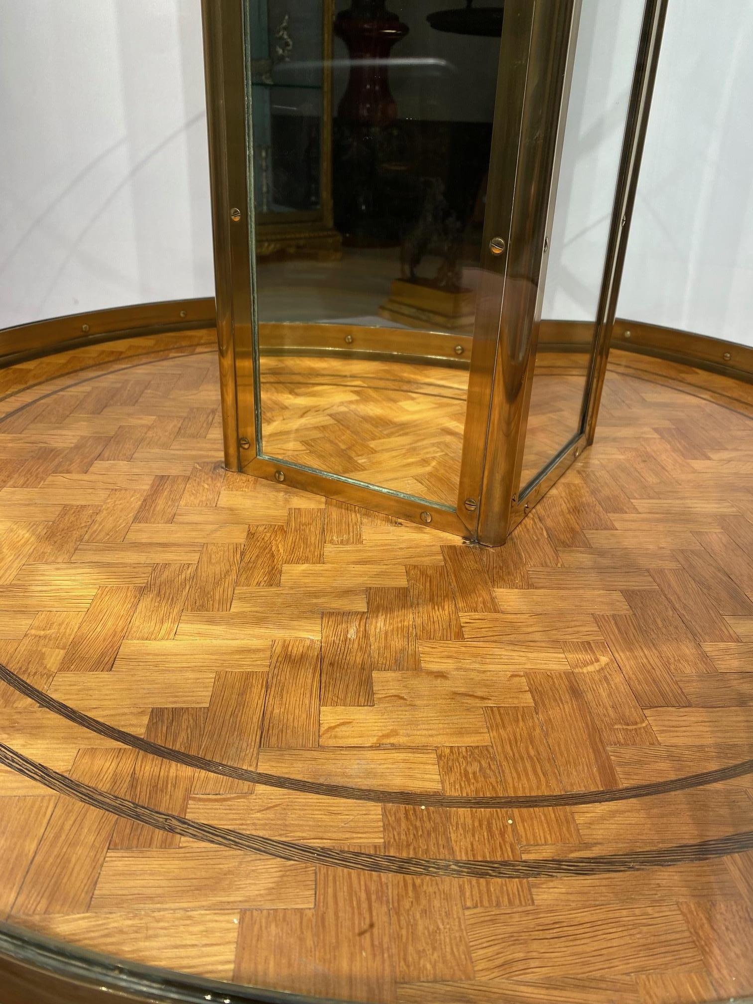 An early 20th century English round freestanding  display cabinet. 6