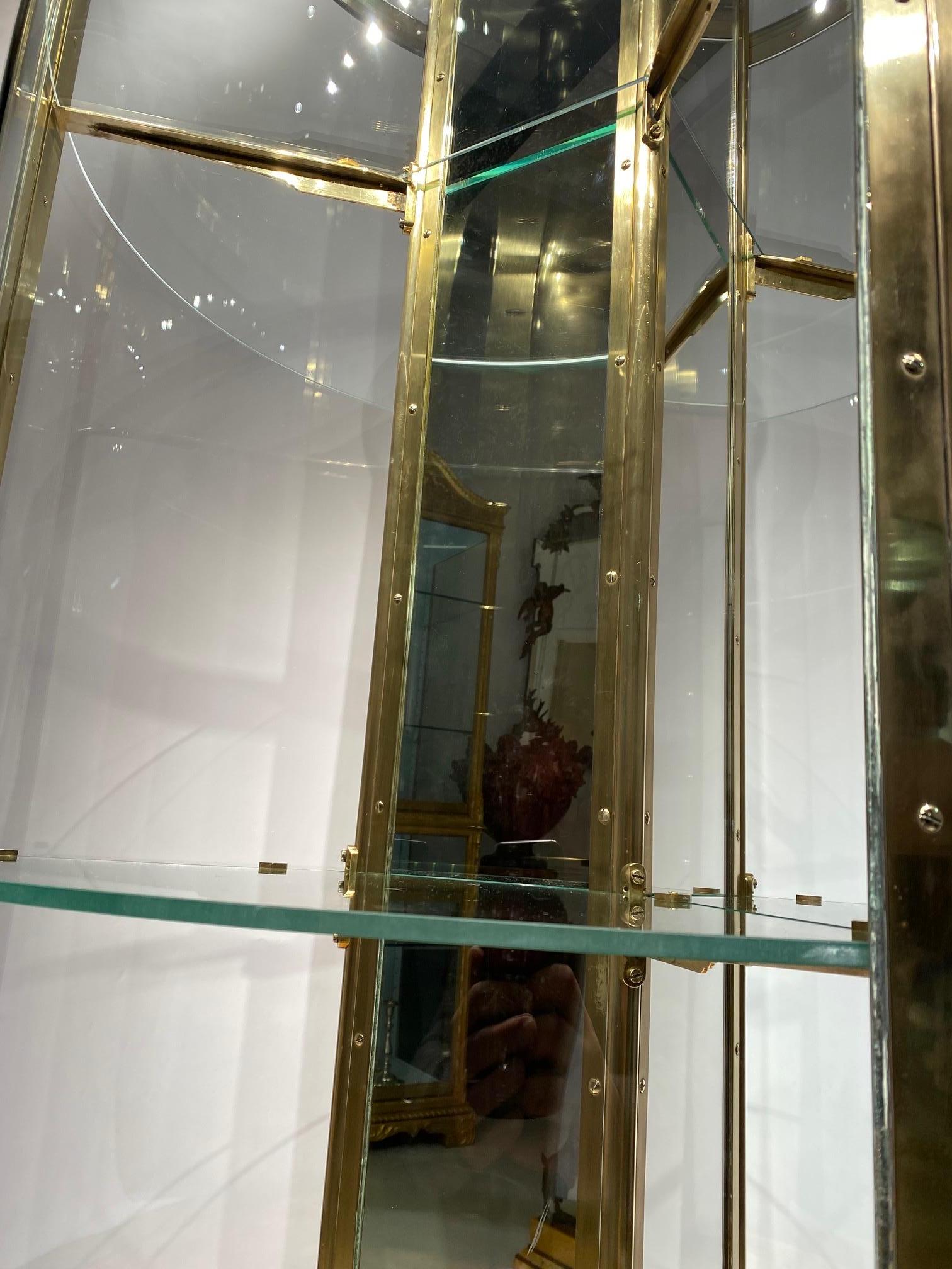 An early 20th century English round freestanding  display cabinet. 7