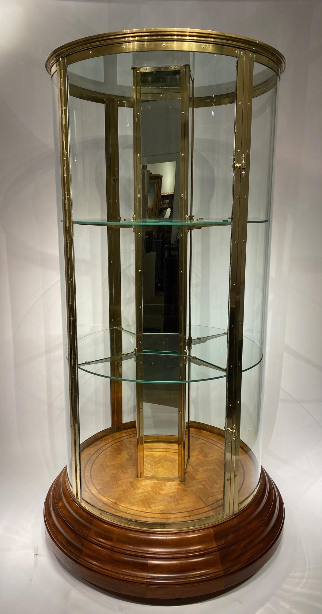 An early 20th century English round freestanding  display cabinet. 8