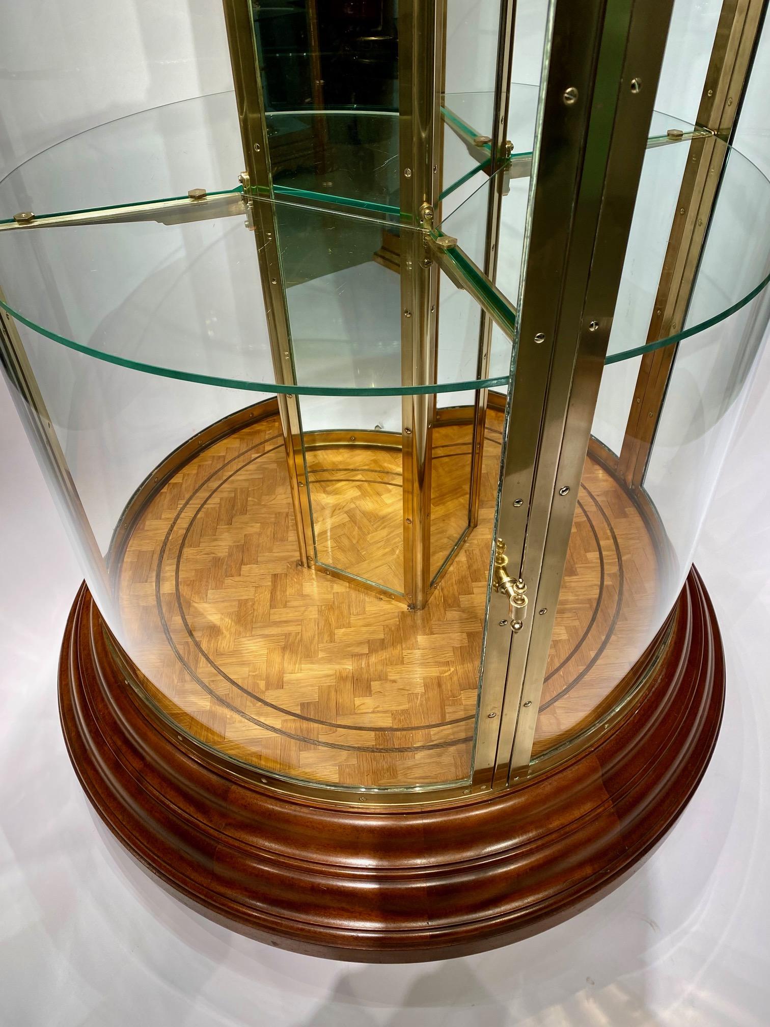 Late Victorian An early 20th century English round freestanding  display cabinet.