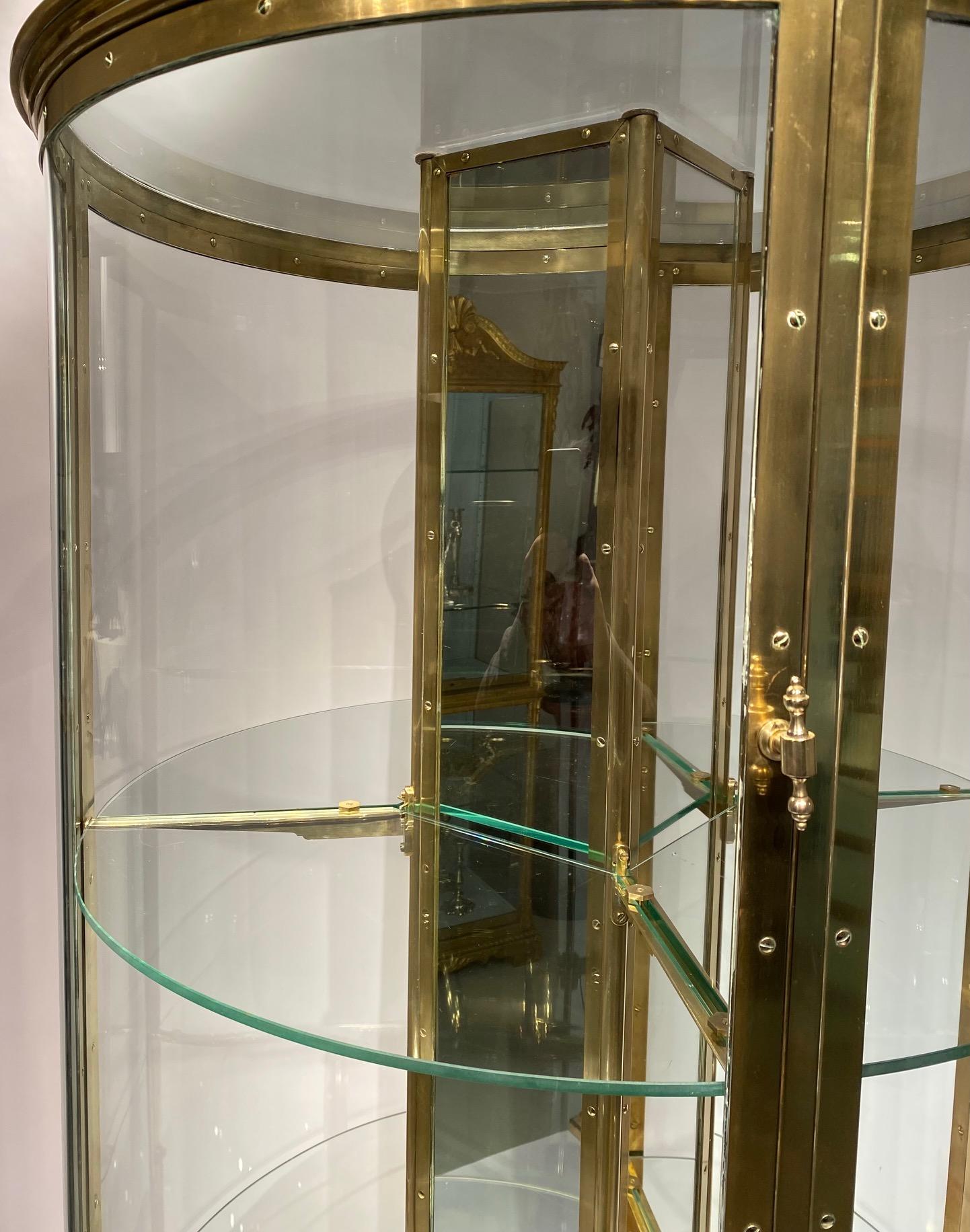 An early 20th century English round freestanding  display cabinet. 1