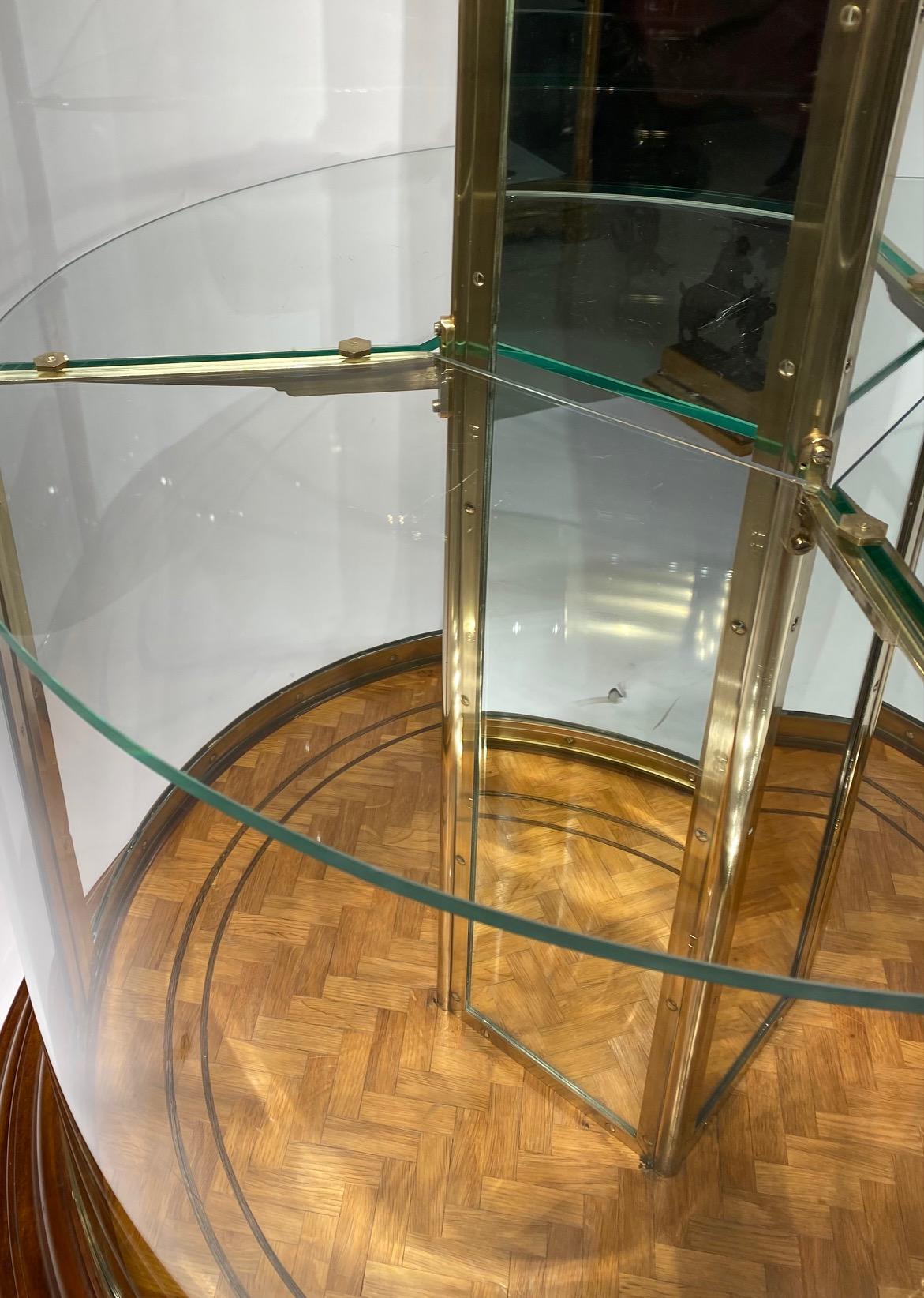 An early 20th century English round freestanding  display cabinet. 2