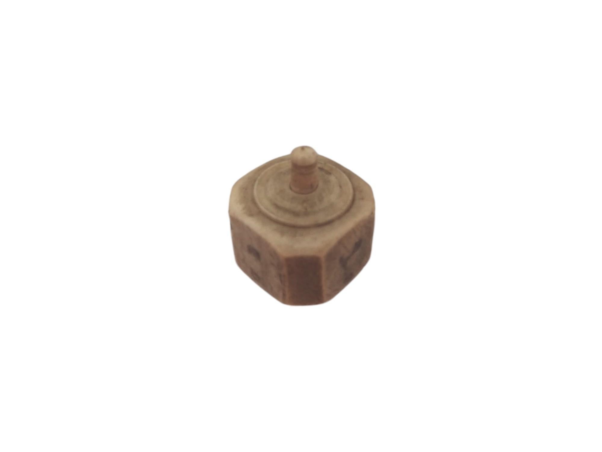 A 19th Century European Bone Dreidel 1