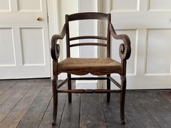 Fauteuil en faux coromandel du 19e siècle