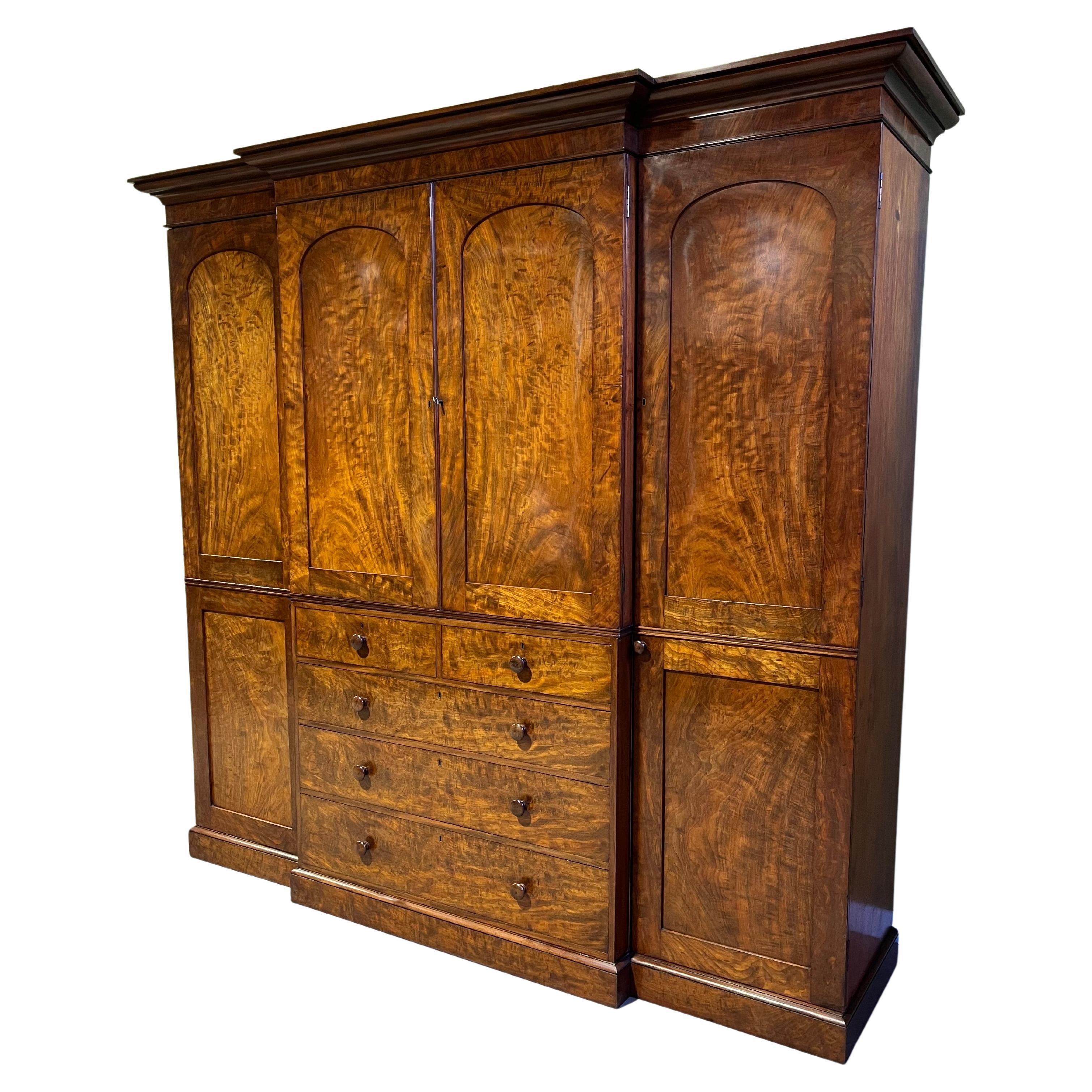 A 19th century flamed mahogany country house breakfront wardrobe For Sale