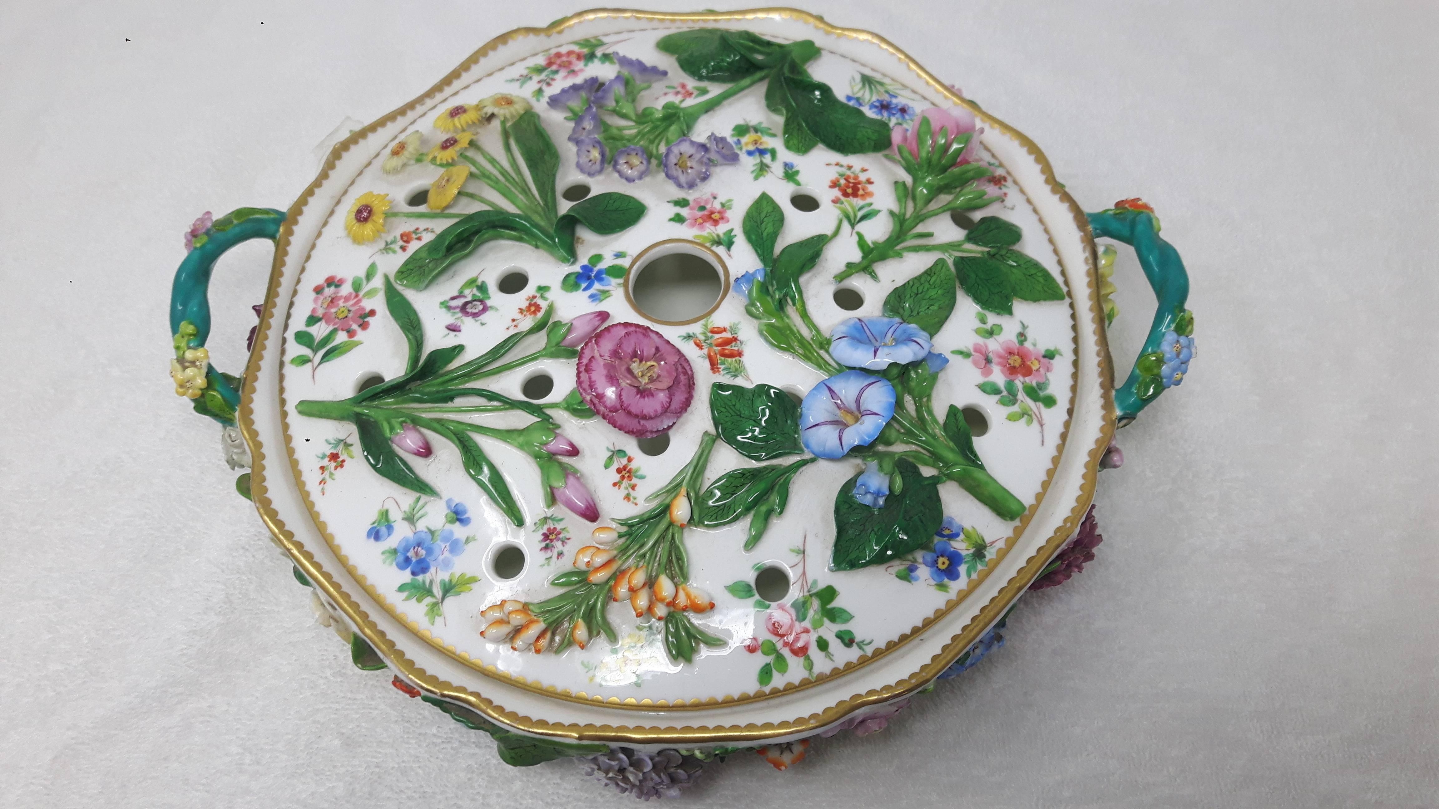 A lovely Minton pot pourri and lid in the Meissen style, encrusted with hand-moulded leaves and flowers and painted with various varieties of flowers. The handles are entwined twigs.
Minton porcelain, circa 1870.