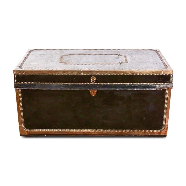 A 19th century French black leather trunk with brass studs and trim, and retaining its original brass handles at each end. An excellent size for a coffee table.
The brass trim contrasts handsomely against the black surfaces.


 