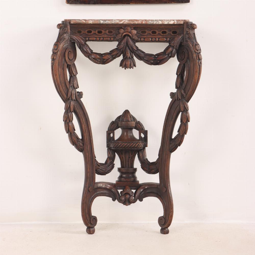 A 19th century French carved walnut console table with conforming trumeau mirror In Good Condition For Sale In Philadelphia, PA