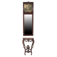 A 19th century French carved walnut console table with conforming trumeau mirror