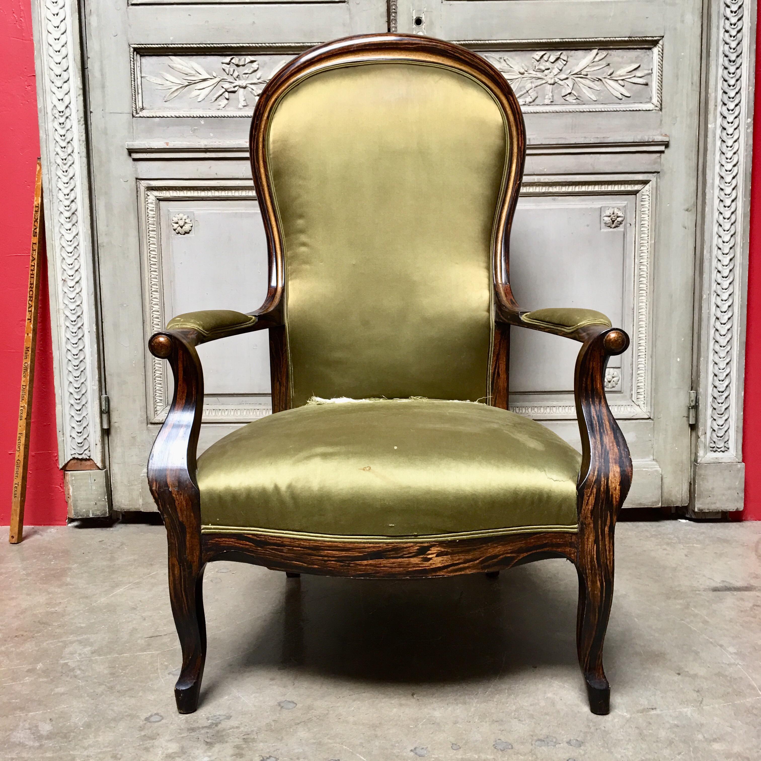 A 19th century French Voltaire Armchair with a faux rosewood painted finish. This imposing lounge chair has a wide well-sprung seat pad sitting on pleasing out-swept cabriole legs. A very solid and classic chair. 


  