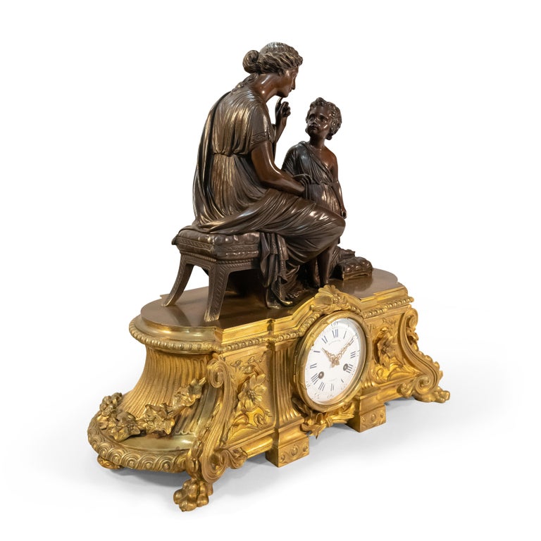 A 19th Century French Gilt & Patinated Bronze Figural Mantel Clock by Raingo In Excellent Condition For Sale In Los Angeles, CA