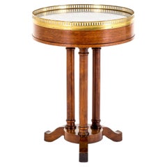 A 19th Century French Gueridon Table with a Marble top and Brass Gallery