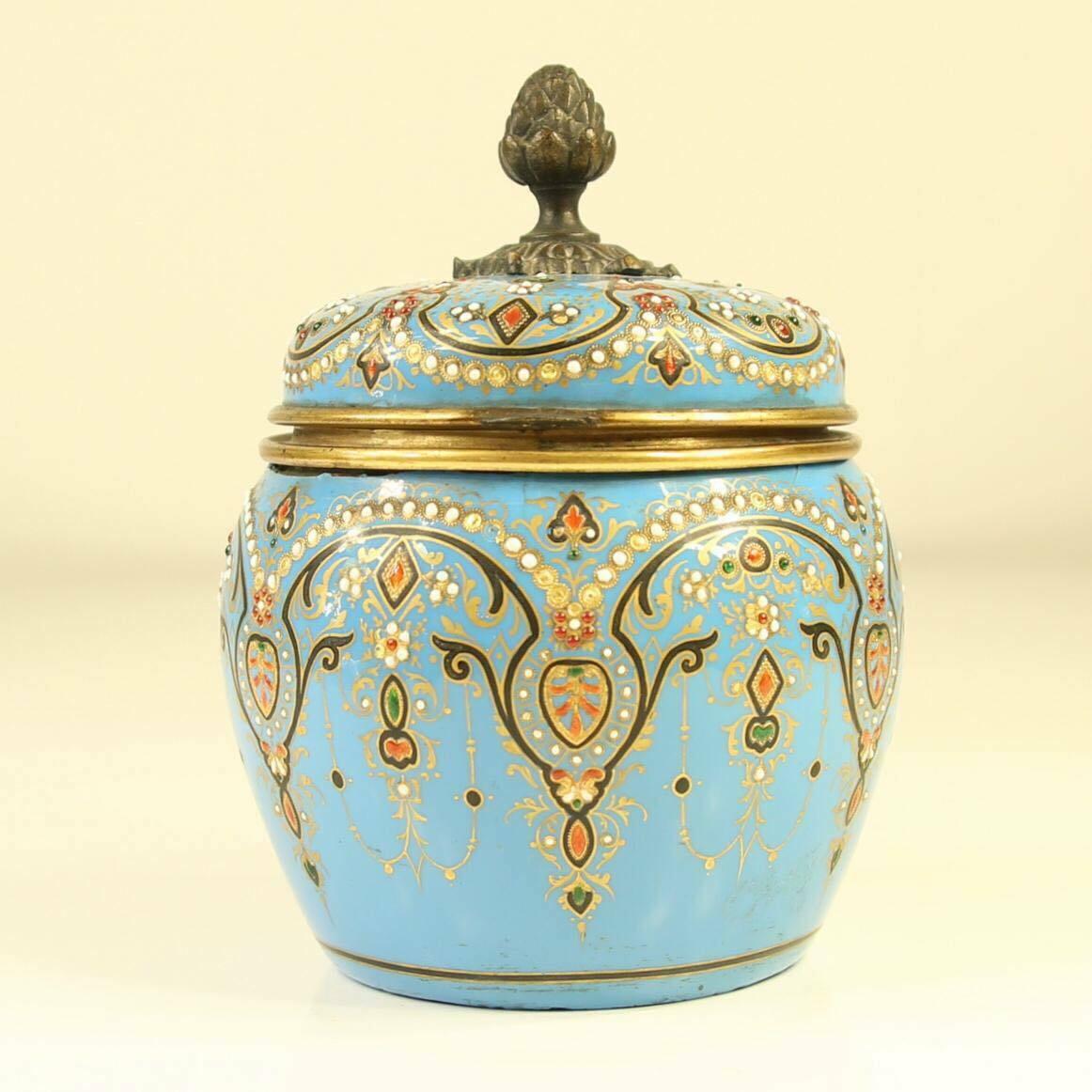 A superb 19th Century French jewelled turquoise enamel jar with hinged cover containing 4 original glass sent bottles with ornate lids.
Very rare and beautiful item in very good original antique condition, a few gems missing from the body however
