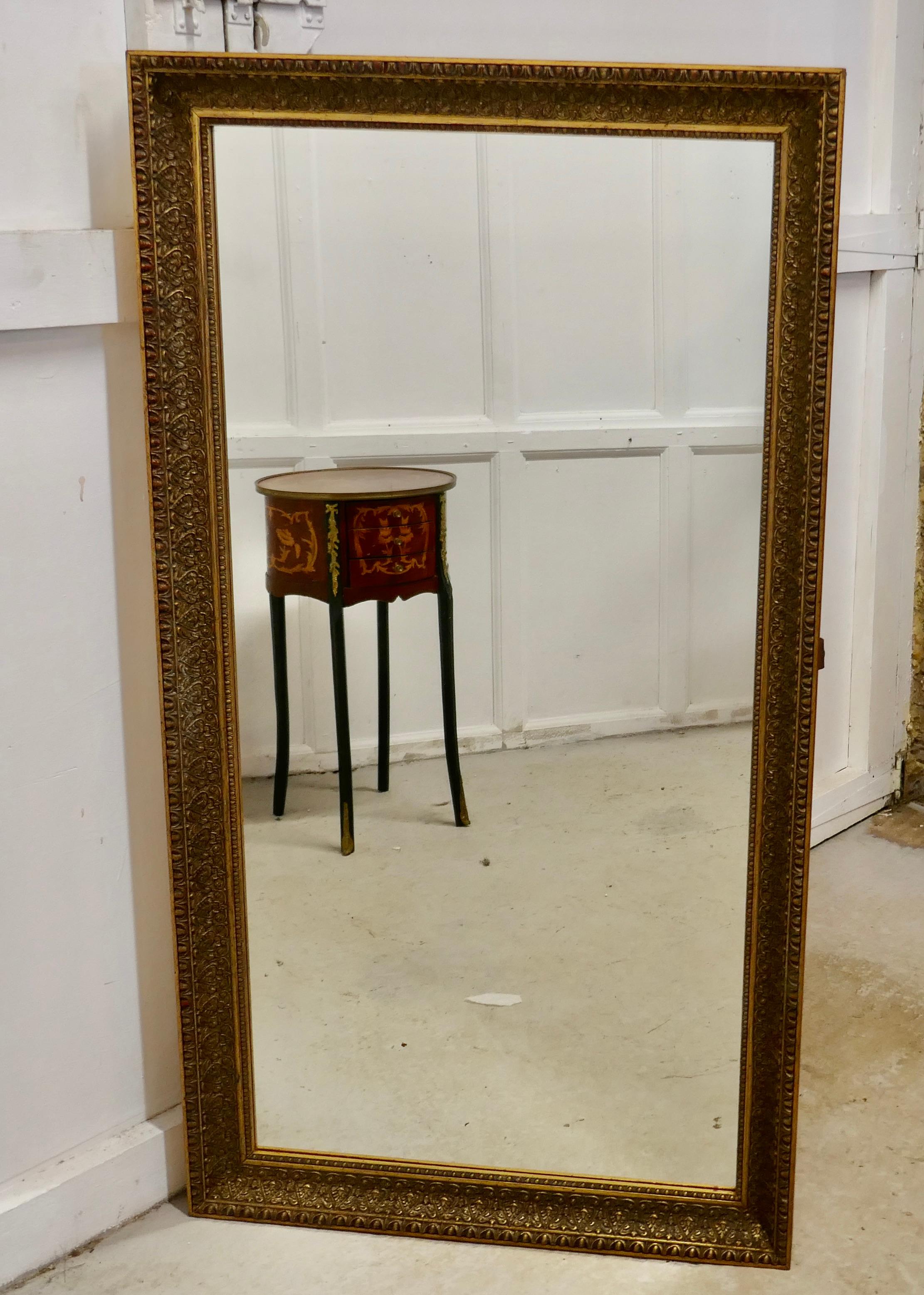 A 19th century French large gilt mirror

The Age Darkened Gold mirror frame is 3” wide with a decorative border
Both the mirror and the frame are in good condition, and will hang portrait or landscape the mirror is 38.5” high, 28” wide and 2”