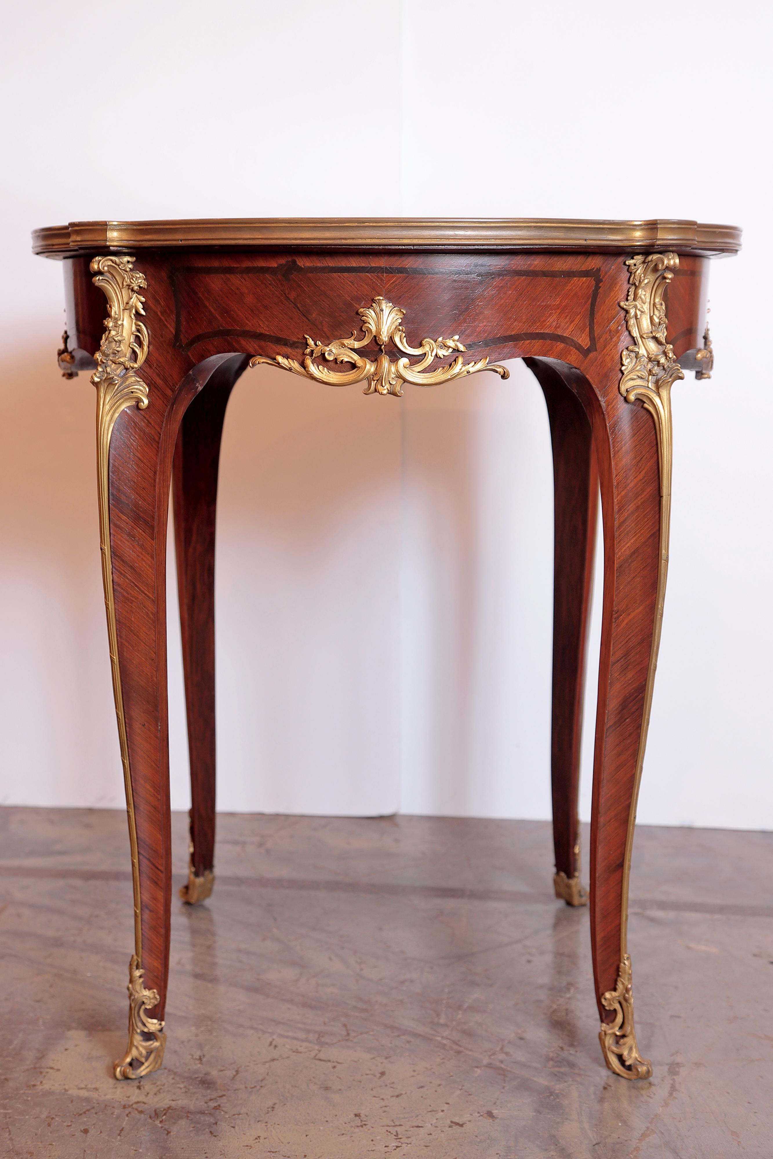A late 19th century French Louis XV mahogany and gilt bronze side table. Fine quality casting gilt bronze.


 