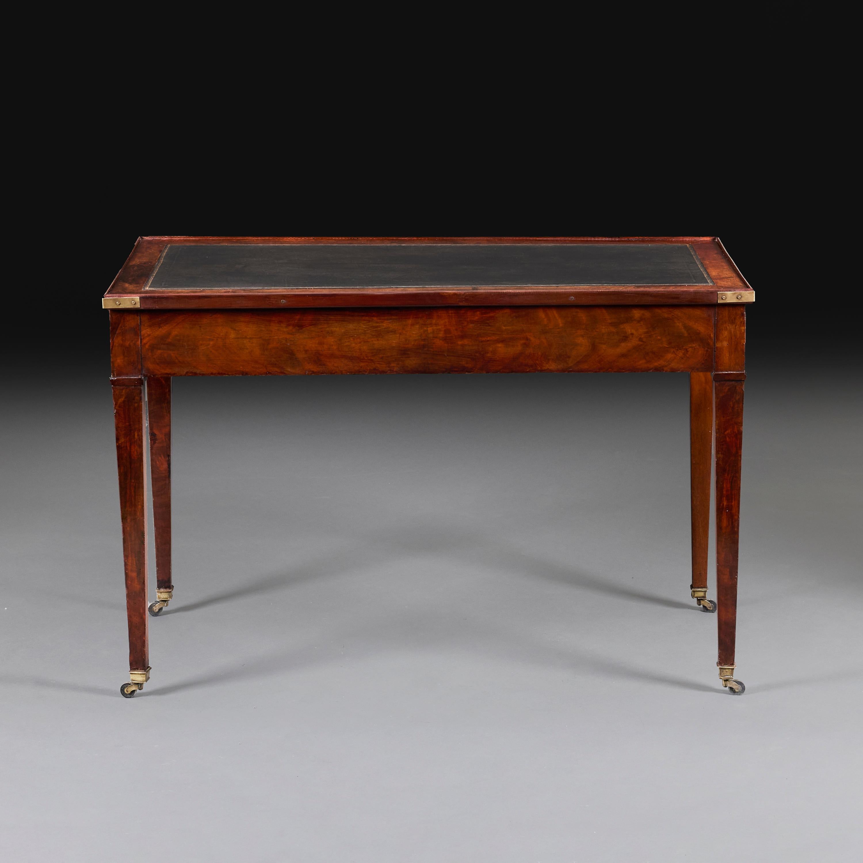 France, circa 1850.

A fine mid-nineteenth century mahogany tric trac table, with backgammon playing surface to the interior with green and white stained lozenges, the top with baize to one side for playing cards, the other with tooled black leather